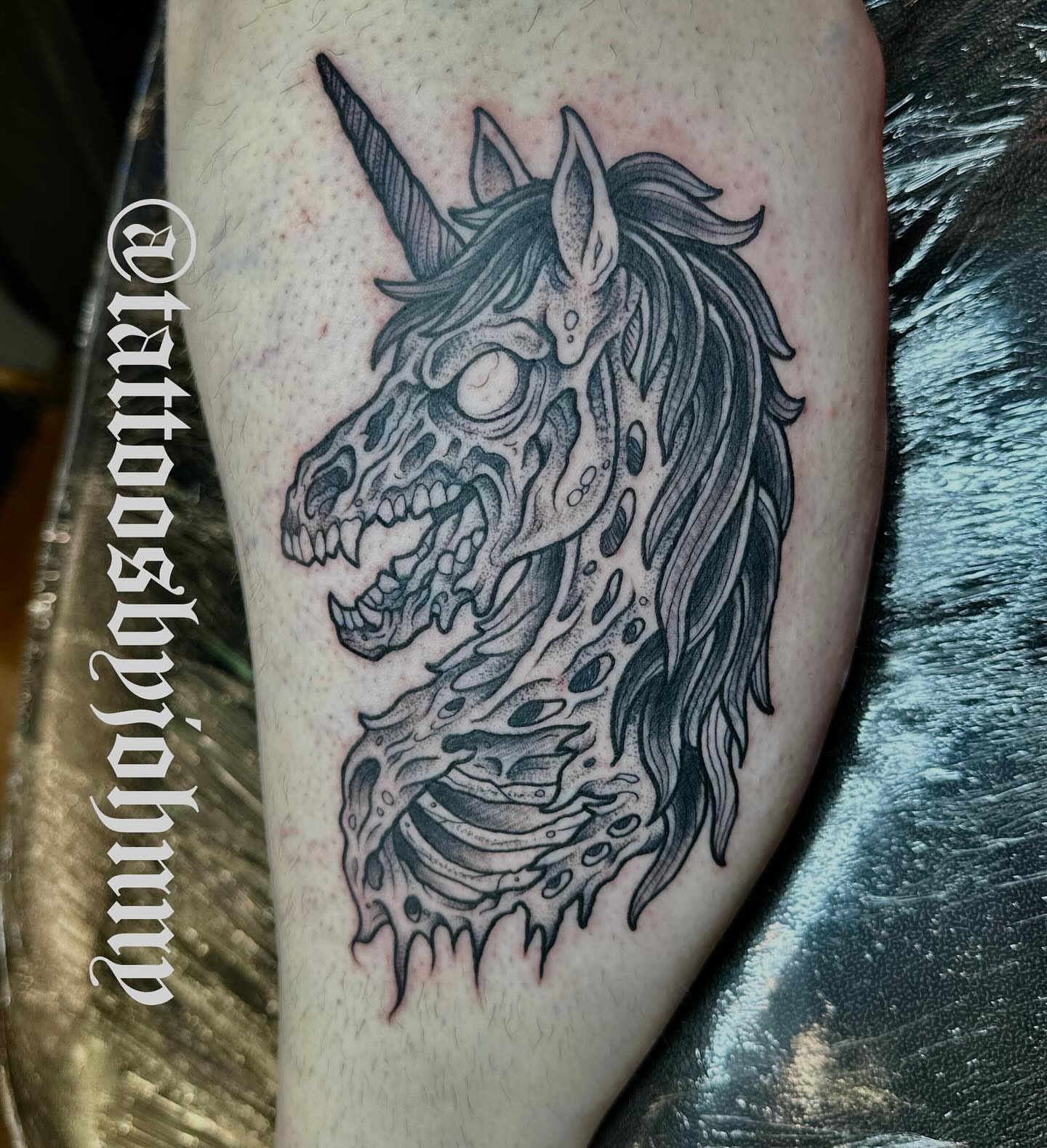 Zombie unicorn dark realism tattoo on the forearm by Johnny Sepulveda