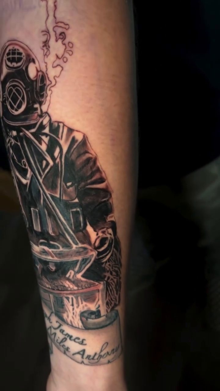 Diver with gas mask and drum realism tattoo by Gage Cottrell
