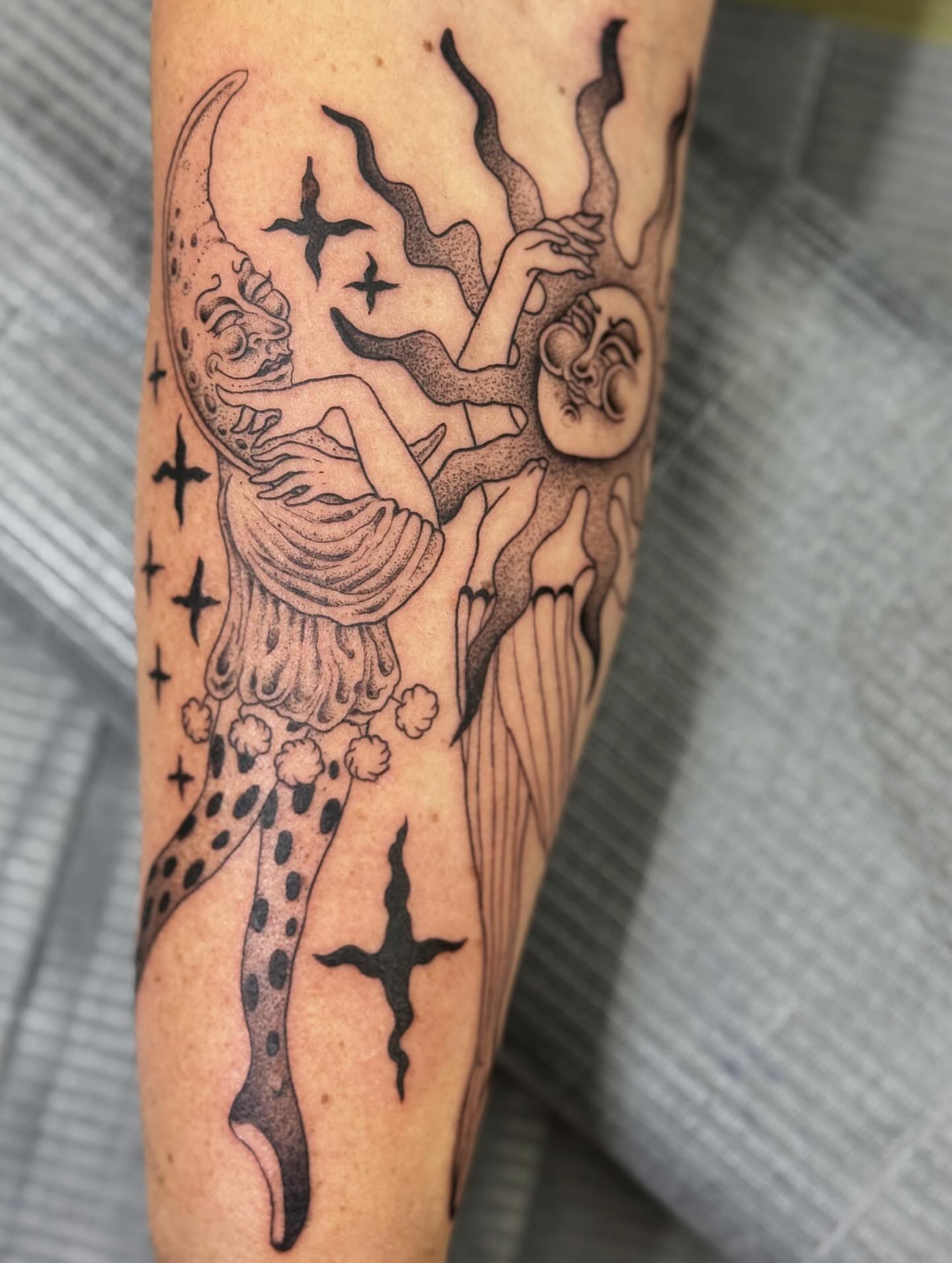 Astral figure dotwork tattoo on the forearm by Writhe Grey