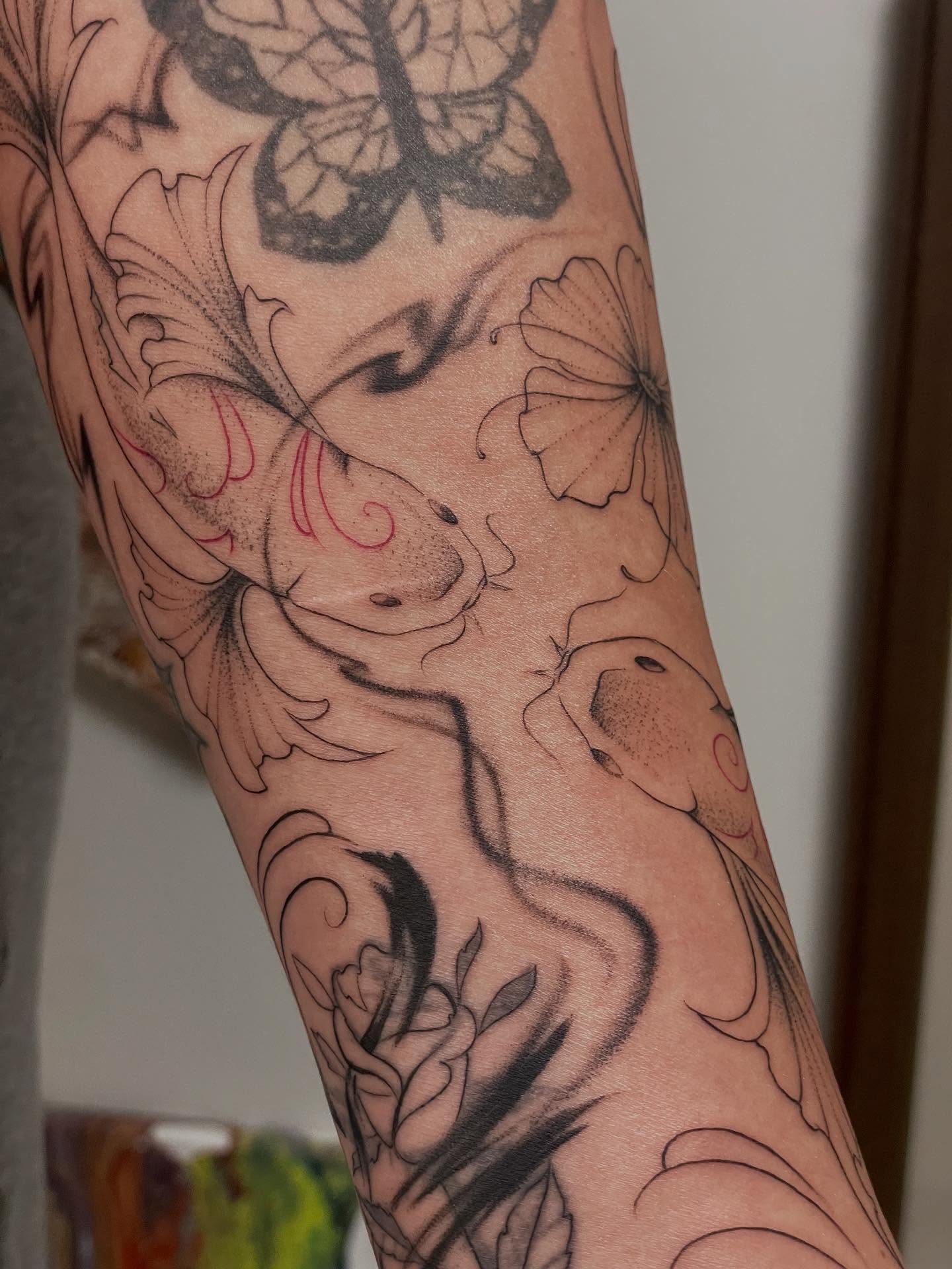 Koi fish and flowers black and grey tattoo on the forearm by Marjeline González🌈🌞
