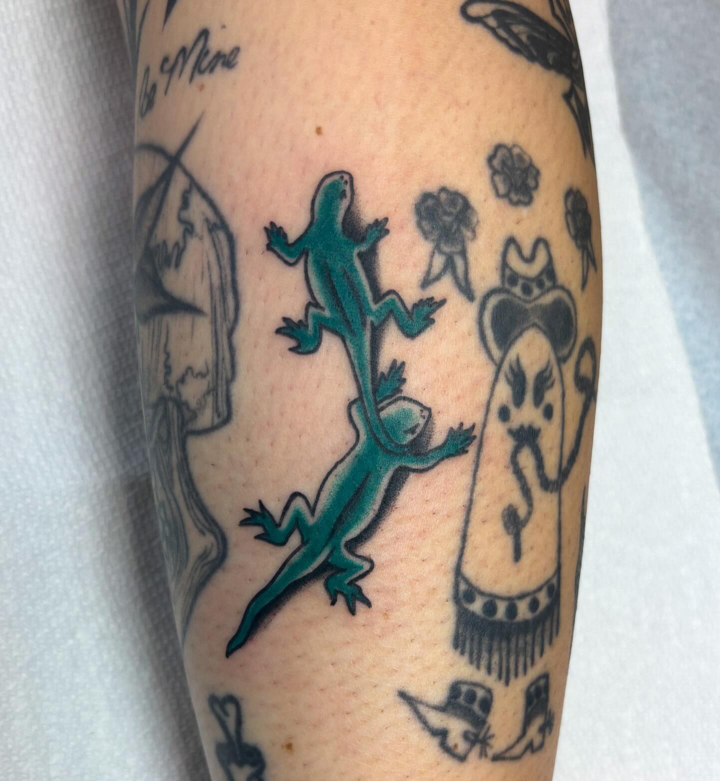 Geckos and flowers dotwork tattoo on the forearm by Katelyn Spence