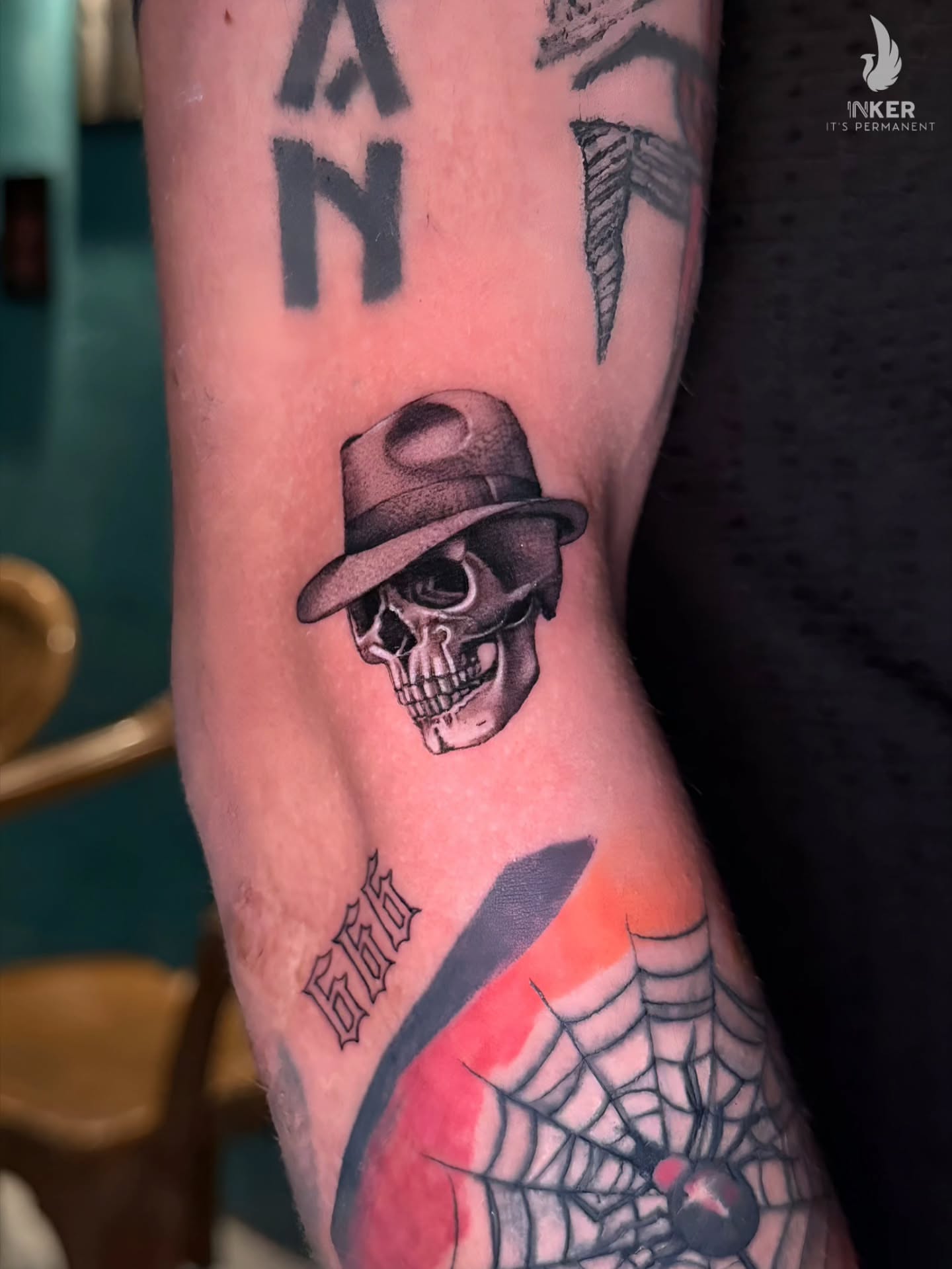 Skull wearing hat realism tattoo on the forearm by Shubhadeep Mukherjee