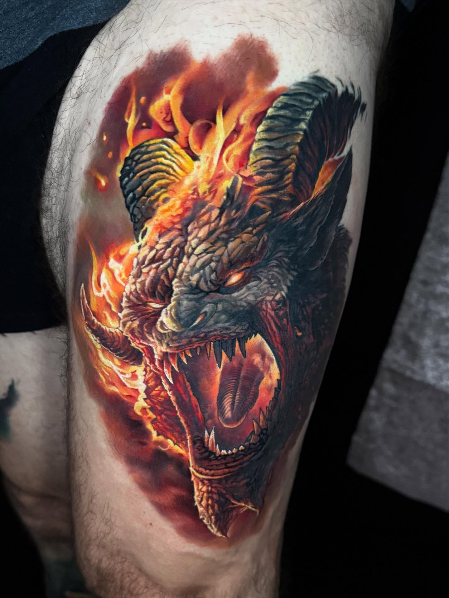 Dragon realism tattoo on the thigh by Derek Gardner