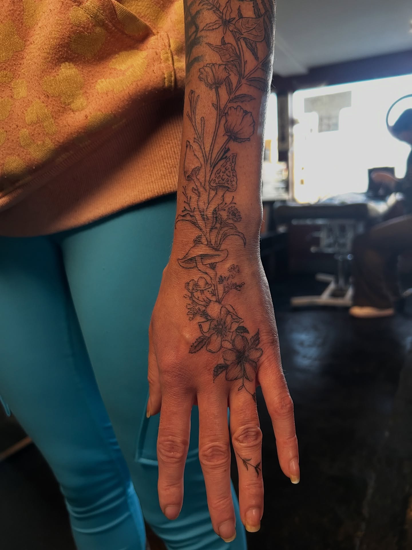 Floral arrangement black and grey tattoo on the hand by King By Trade 👑