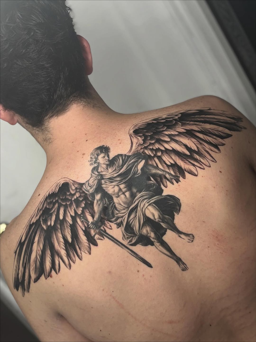 Angel with sword realism tattoo on the back by Tattoos by Tessa