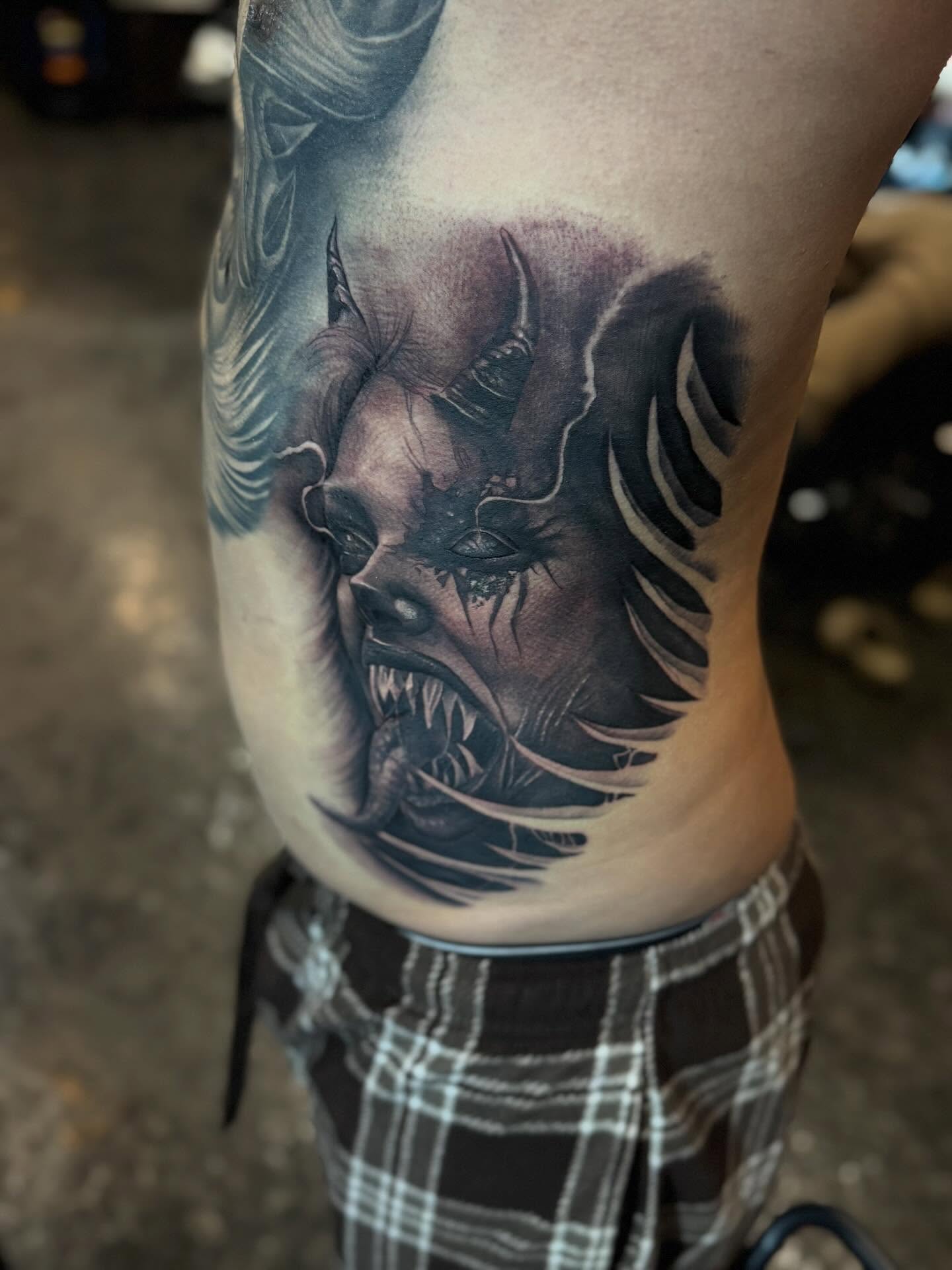 Demon dark realism tattoo on the ribs by Bernie calderon, Fresno, California