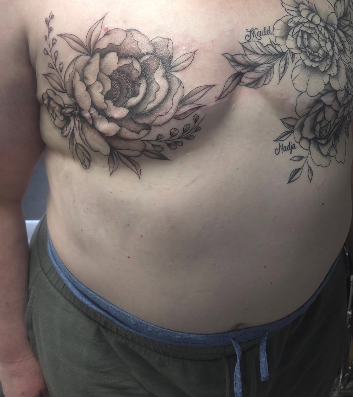 Peony black and grey tattoo on the ribs by Trinity