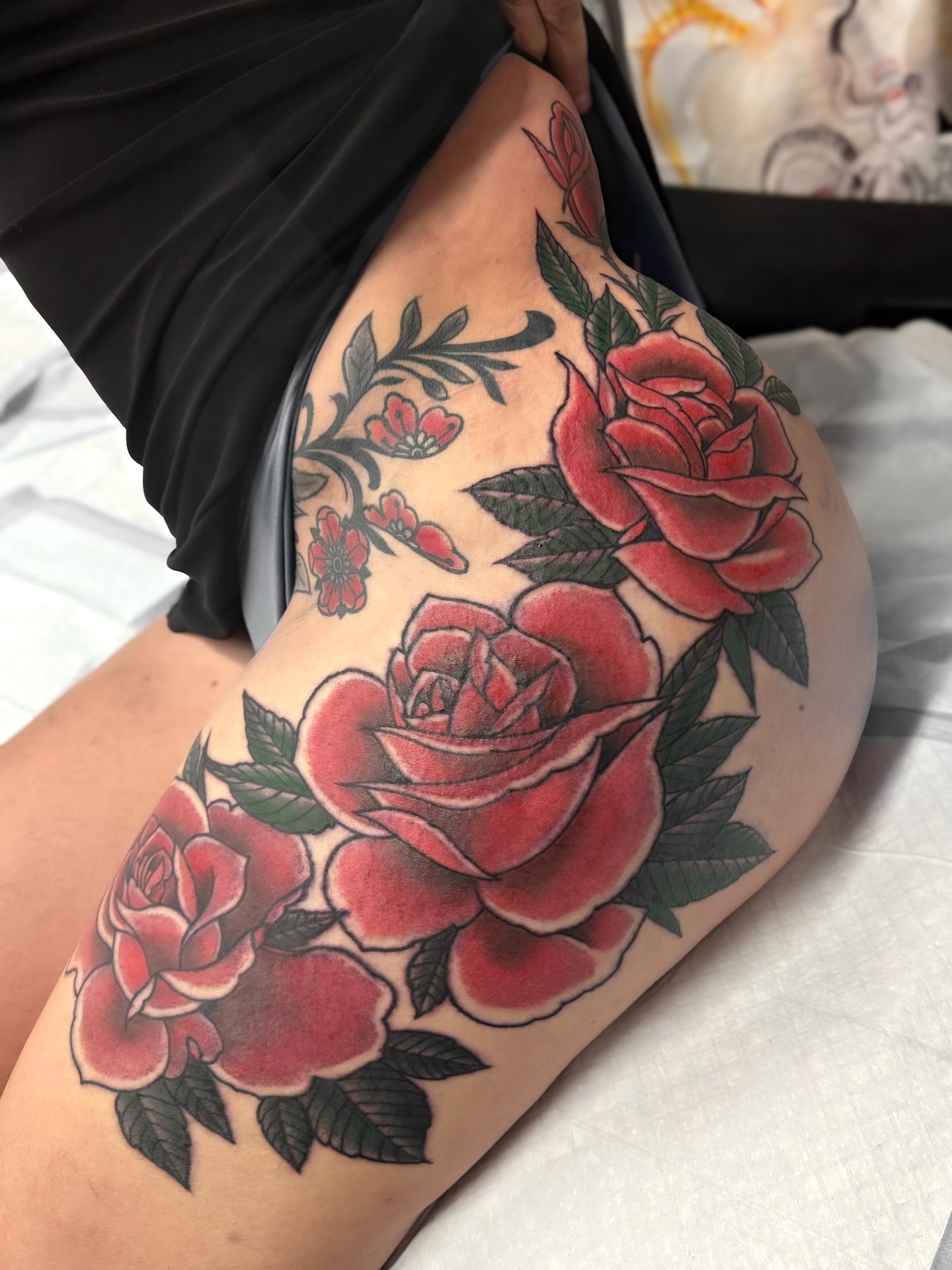 Roses American traditional tattoo on the thigh by Marcos Rivera, Laredo, Texas
