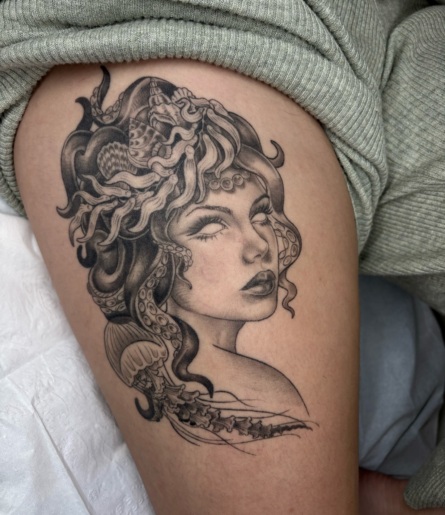 Medusa realism tattoo on the thigh by Kinsey Miller