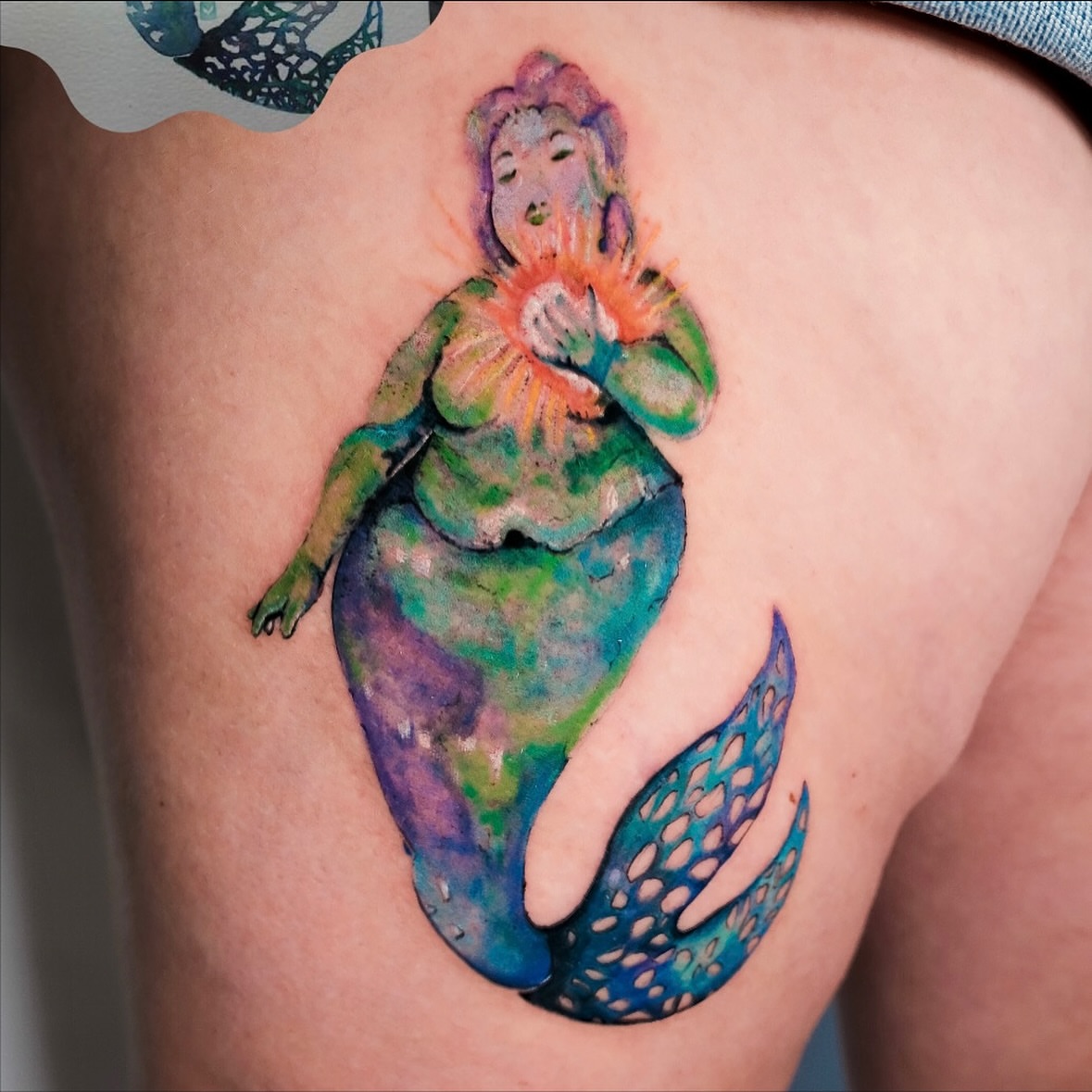 Mermaid watercolor tattoo on the thigh by NAS