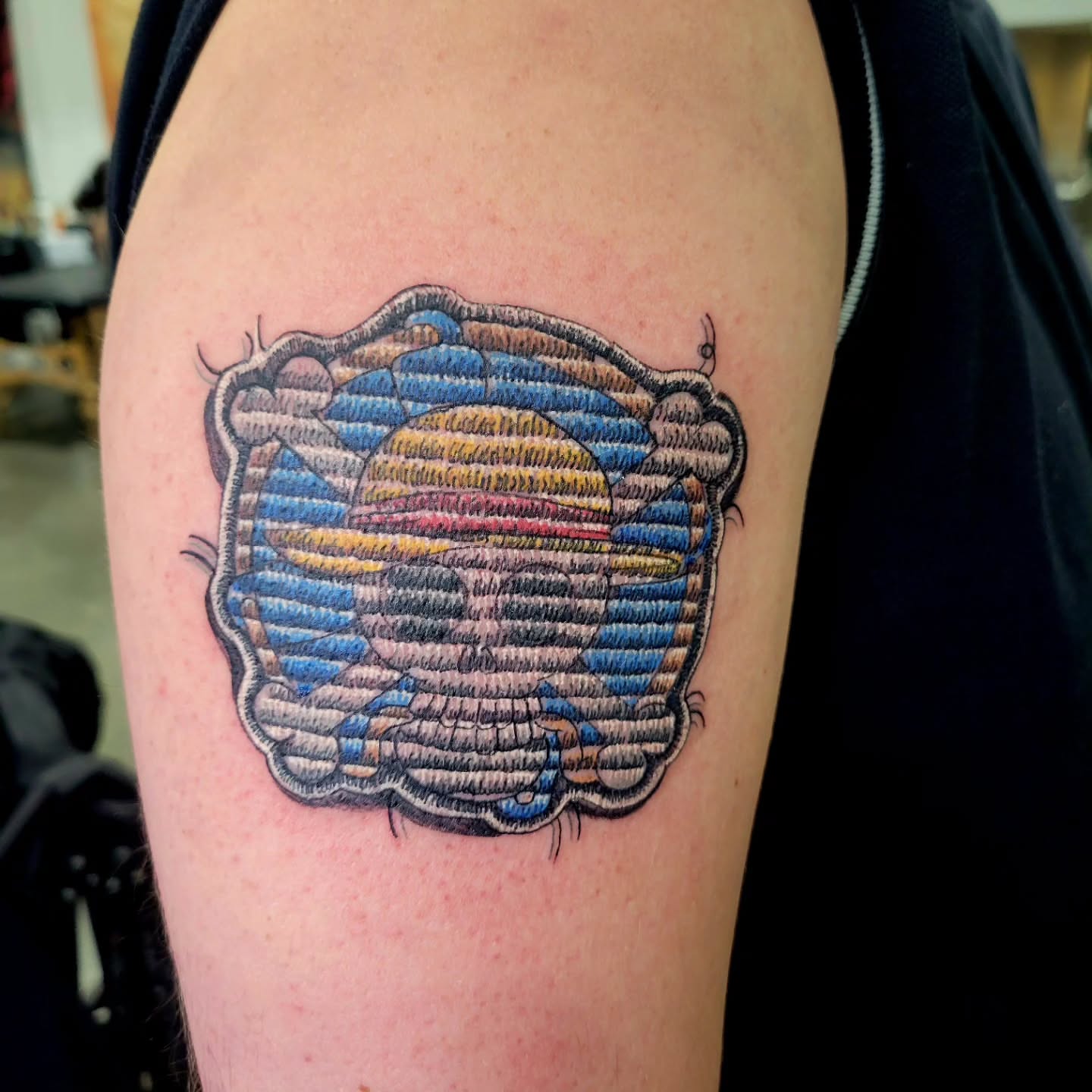 Rainbow cloud dotwork tattoo on the shoulder by Naez Ink AKA Renae Madison, Macomb, Illinois