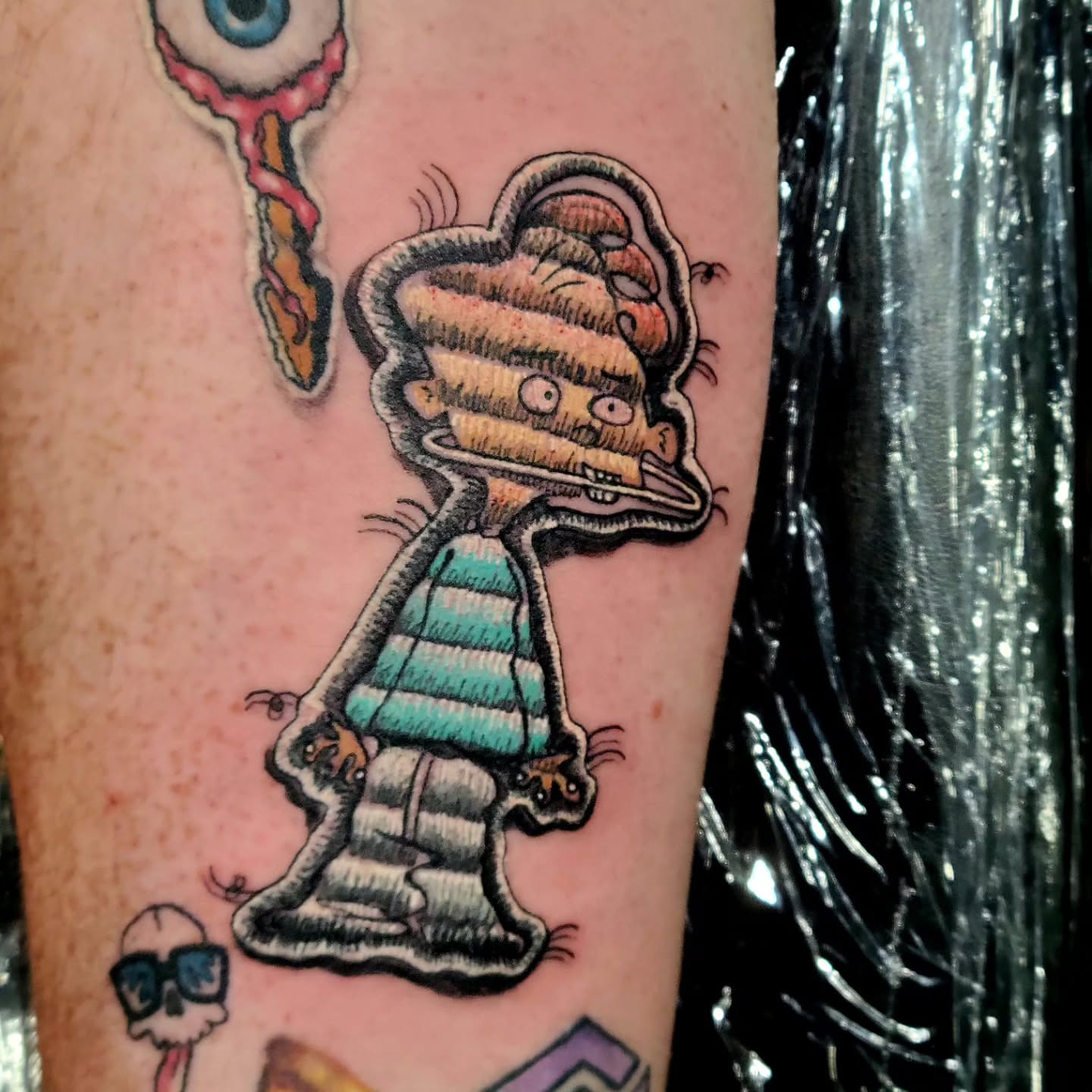 Alien character neo-traditional tattoo on the forearm by Naez Ink AKA Renae Madison, Macomb, Illinois