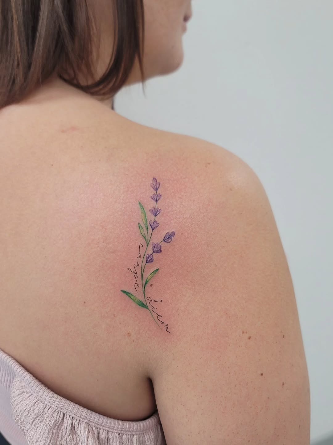Lavender flower fine line tattoo on the shoulder by Las Vegas Fine Line Tattoos