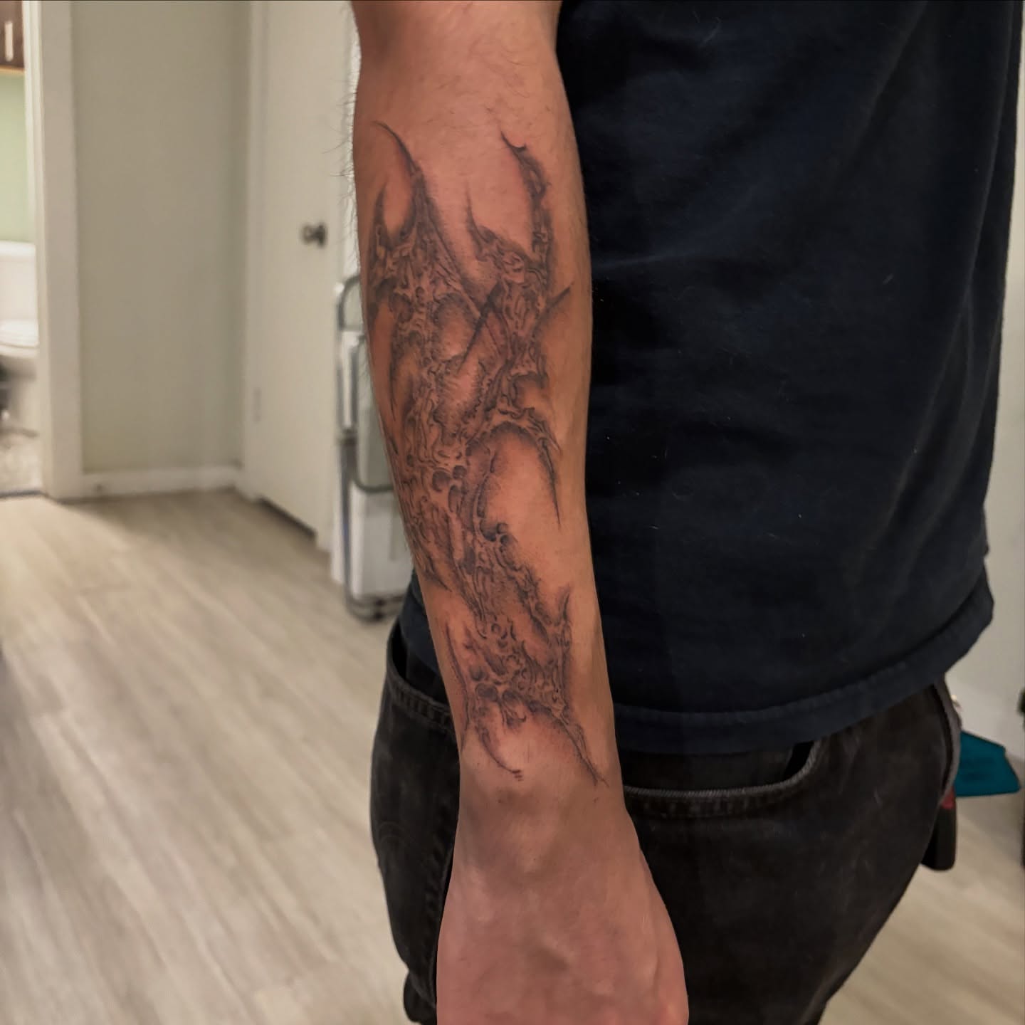 Demon black and grey tattoo on the forearm by @miffythereaper