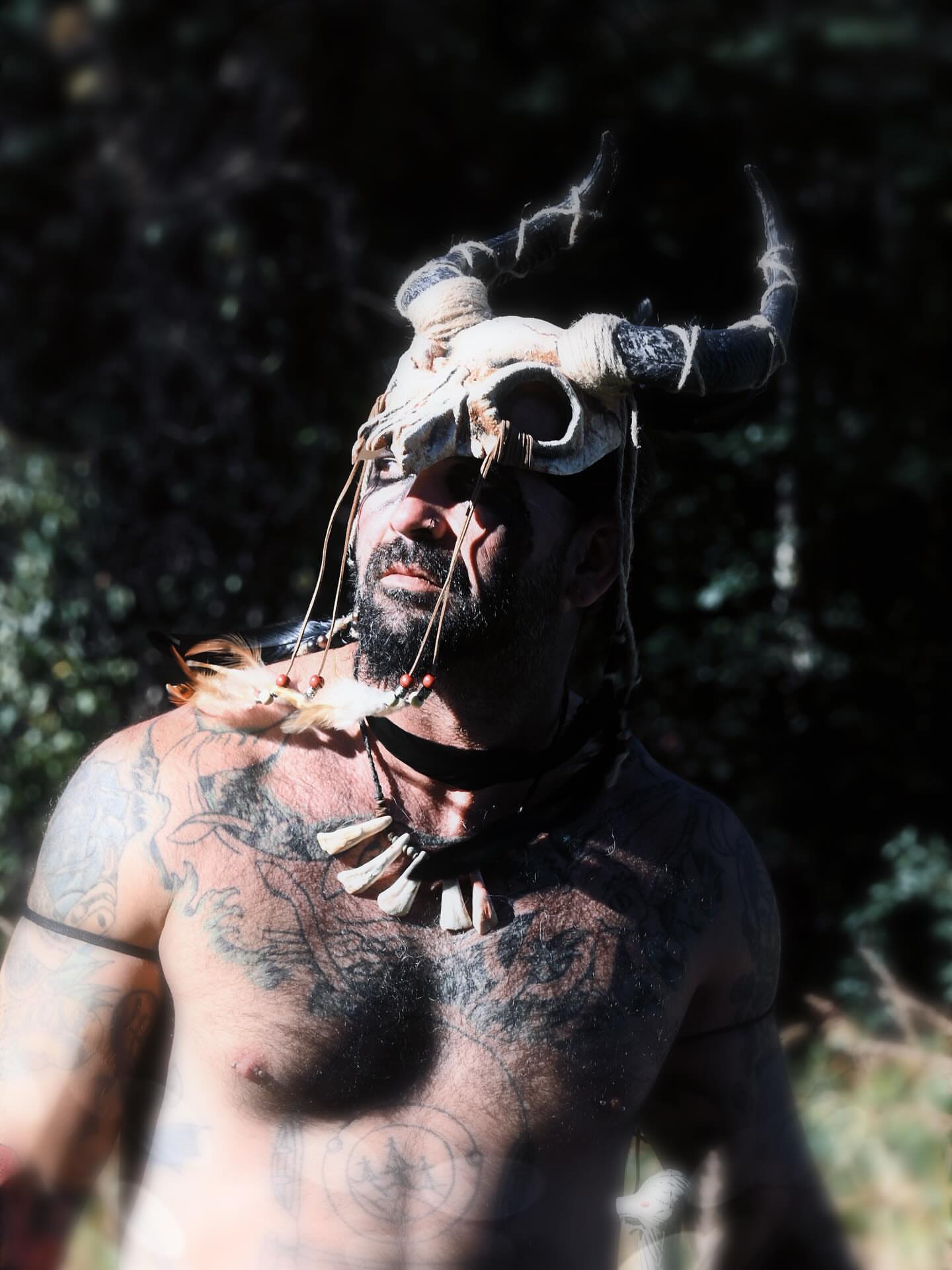 Tribal mask tribal tattoo on the chest by Don Peddicord