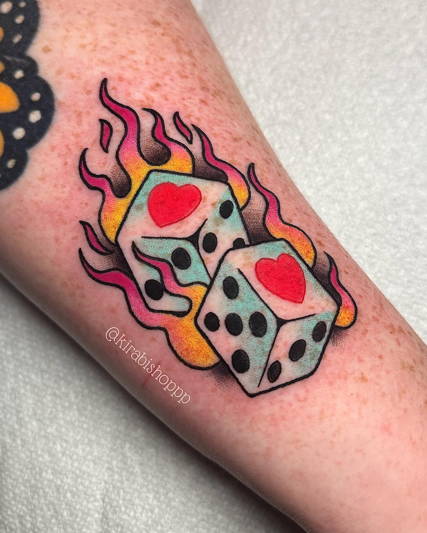 Flaming dice American traditional tattoo on the forearm by 𝔎𝔦𝔯𝔞 𝔅𝔦𝔰𝔥𝔬𝔭