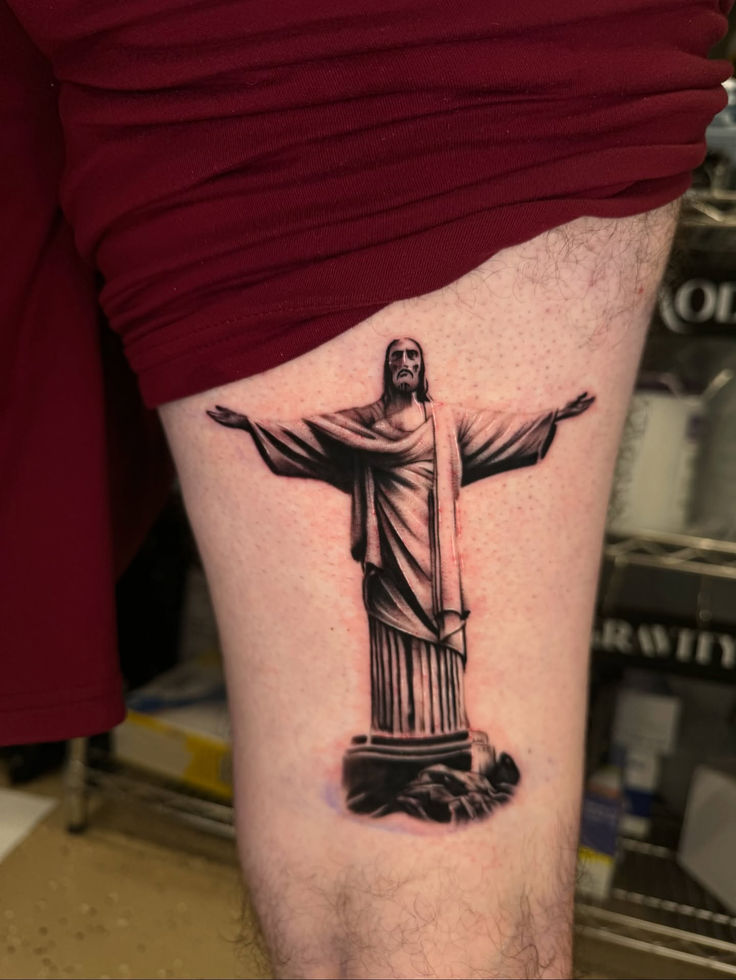 Christ the redeemer statue black and grey tattoo on the thigh by Ian Chancellor, Leighton Buzzard, England