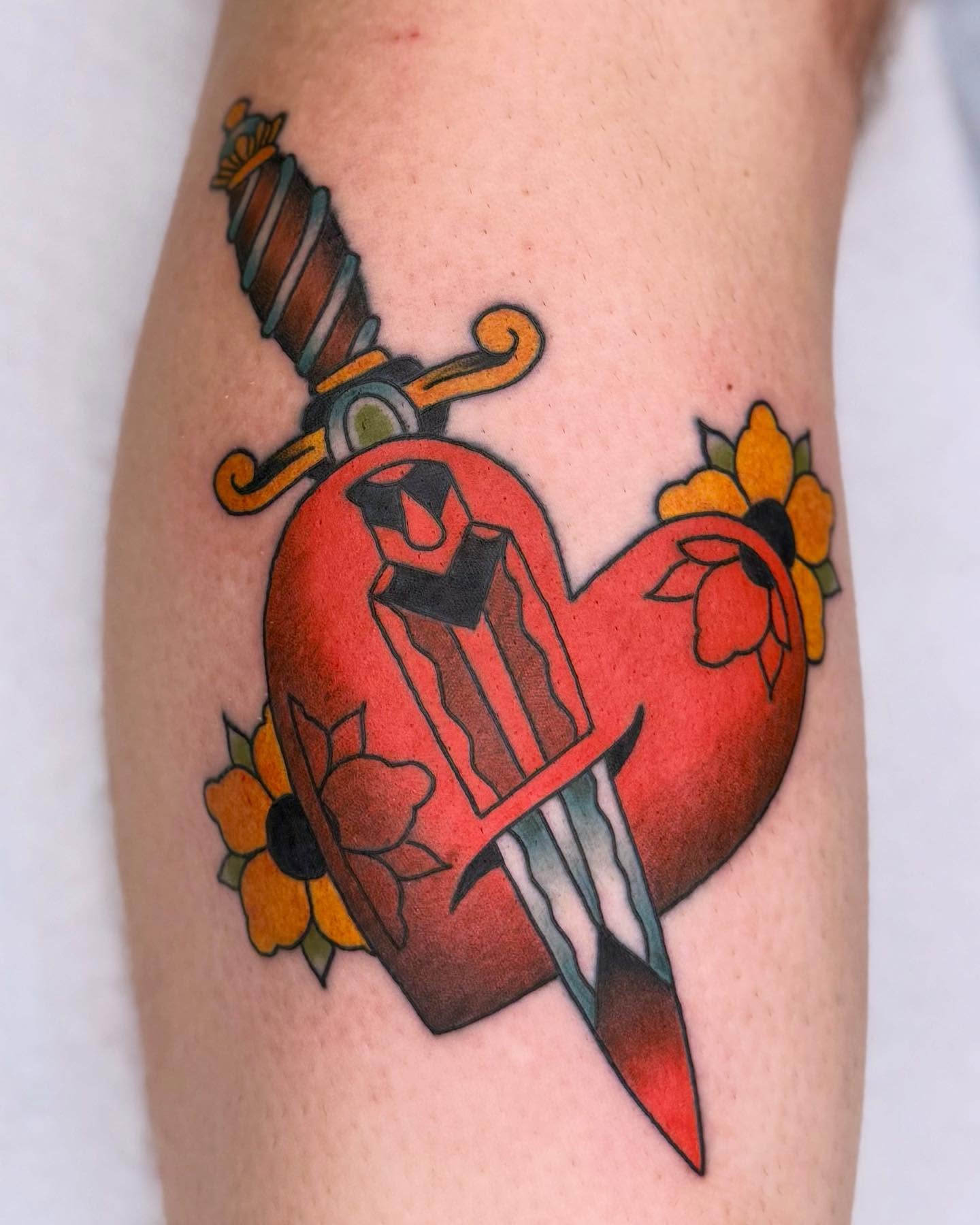 Heart with dagger American traditional tattoo on the forearm by Curtis Stairs, Seattle, Washington