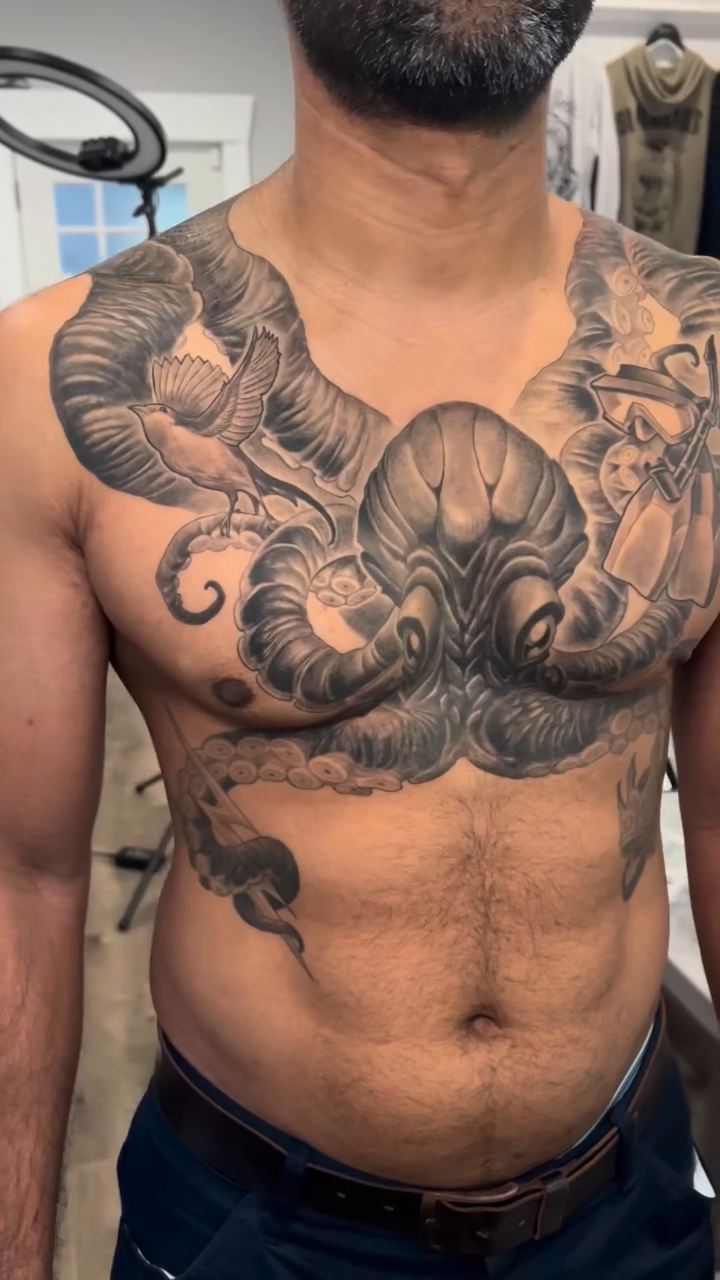 Octopus and ship's wheel realism tattoo by Marvin Silva