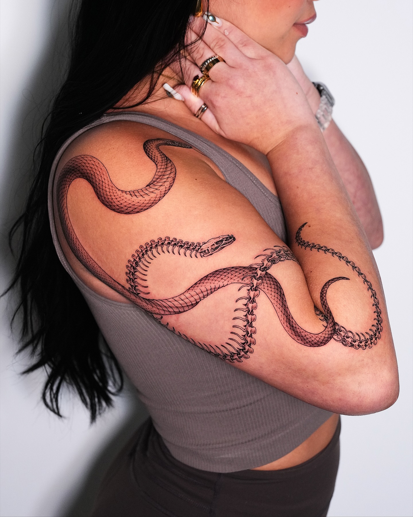 Snake black and grey tattoo on the shoulder by Intat