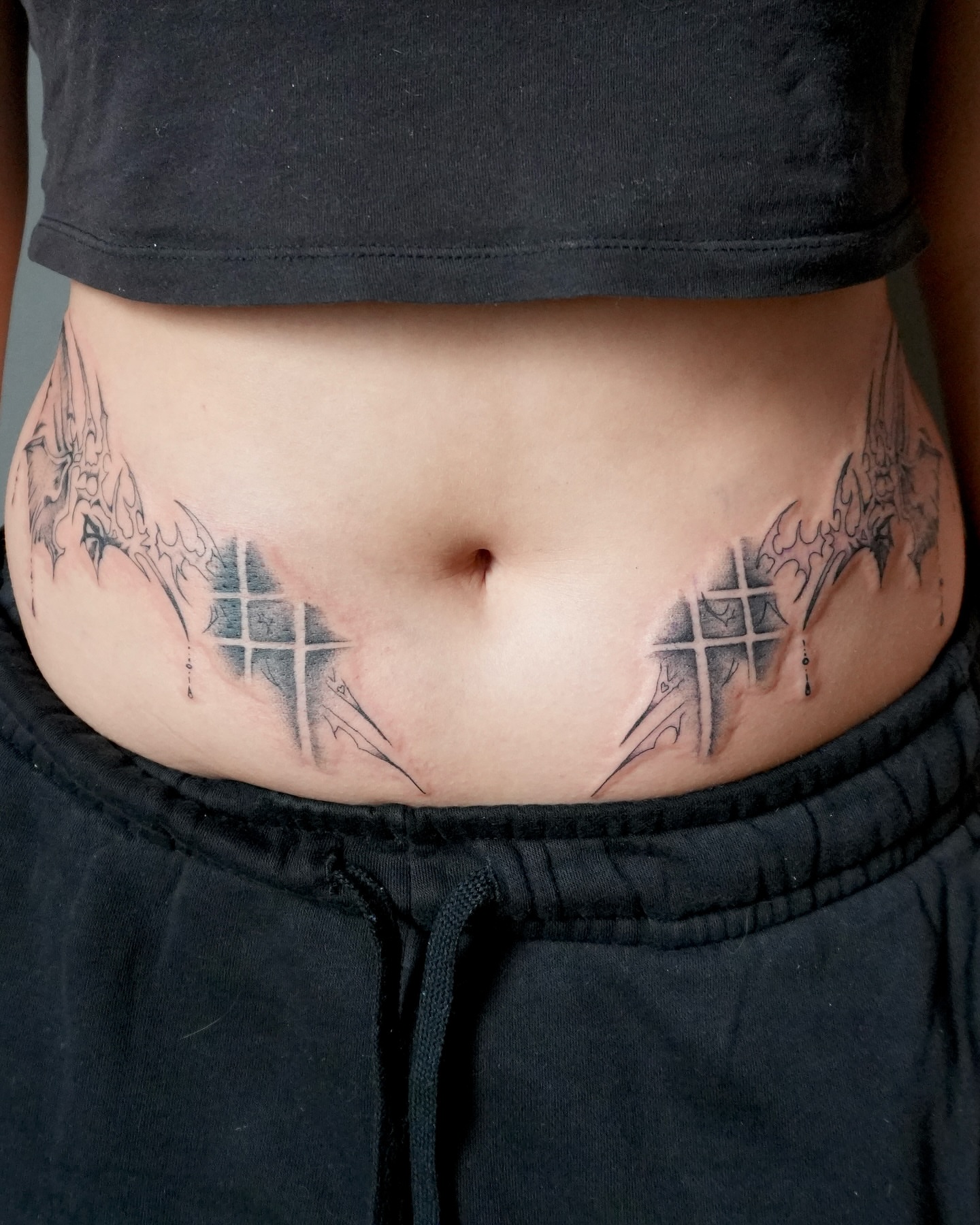 Crosses and wings black and grey tattoo on the torso by Sophie ✨ Nashville Tattoo Artist ✨