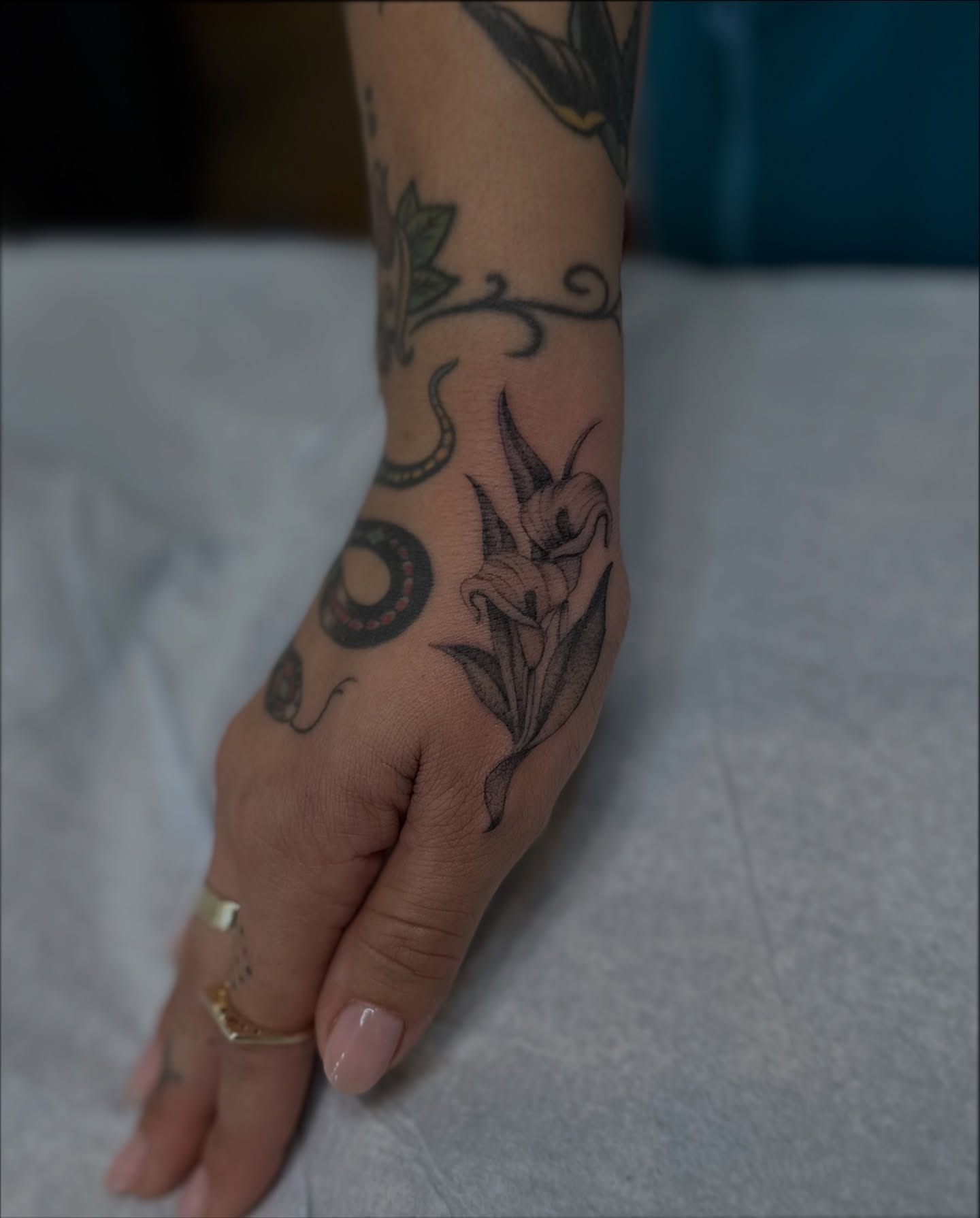 Calla lily black and grey tattoo on the forearm by Адріянна Стабс 🇺🇦, New York, New York