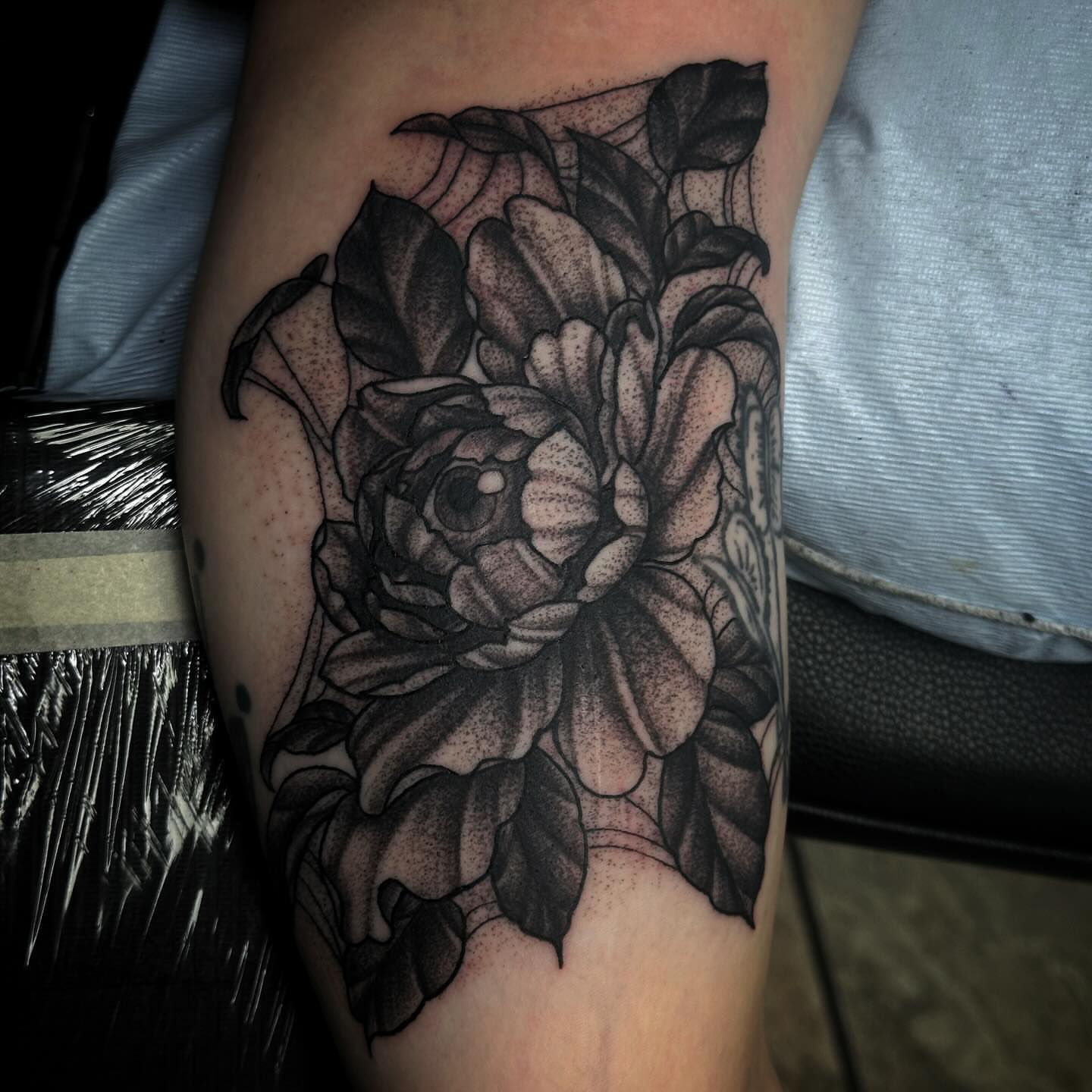 Flower dotwork tattoo on the forearm by Elizabeth Tabler