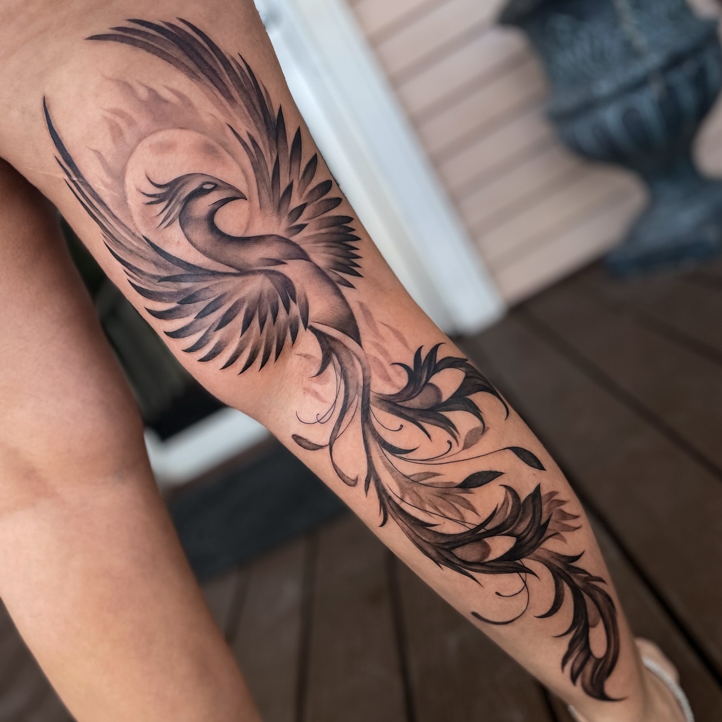 Phoenix black and grey tattoo on the forearm by Erica Olivier