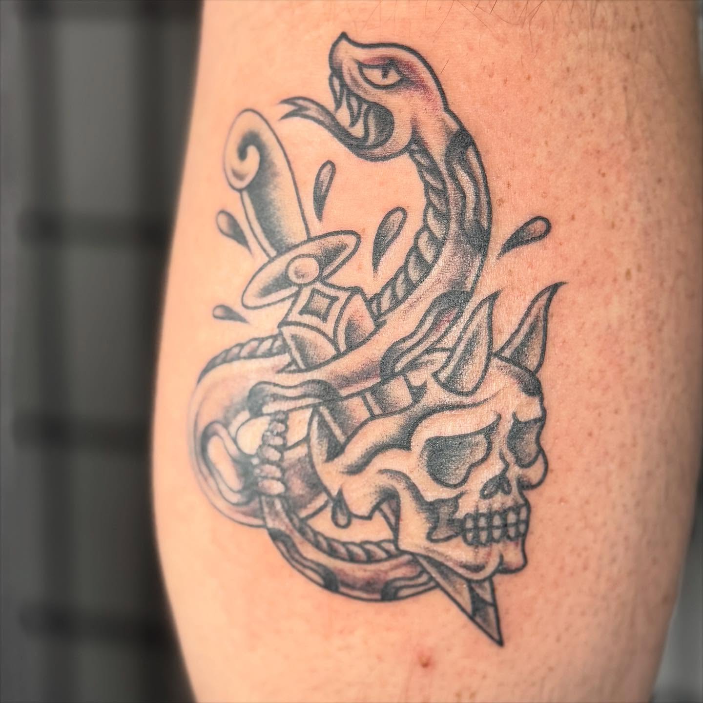 Snake and skull American traditional tattoo on the forearm by Justina🪐