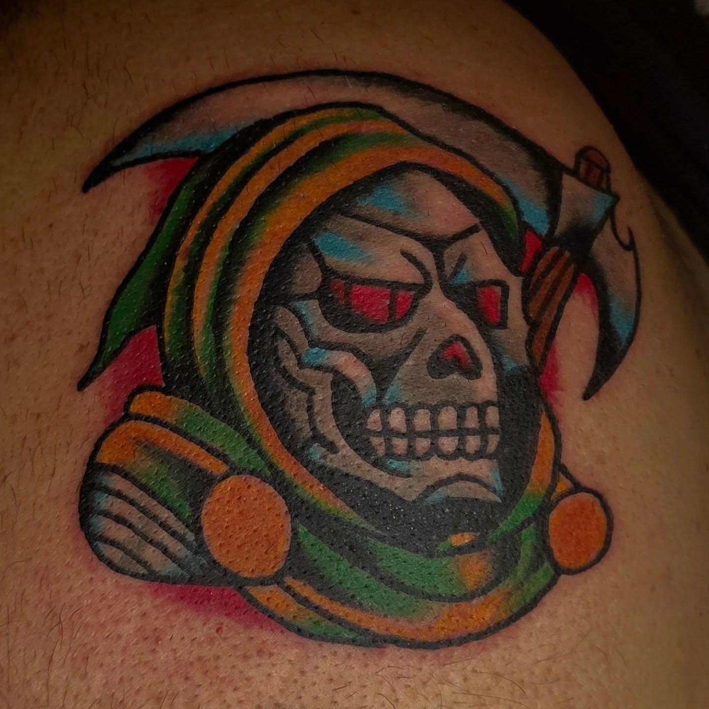 Skull in astronaut helmet American traditional tattoo on the shoulder by Mitch Braver