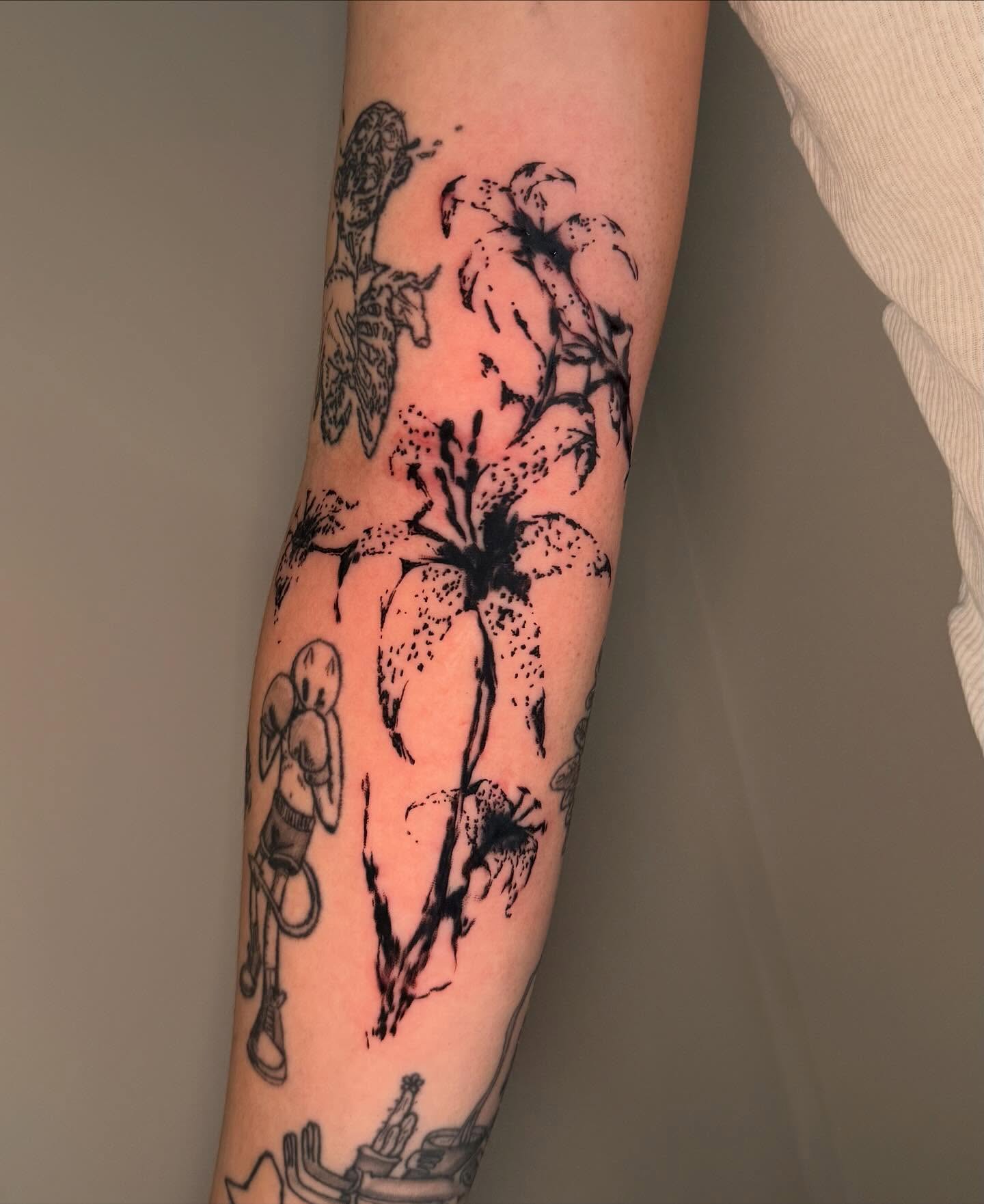 Flowers and bee dotwork tattoo on the forearm by sanjai