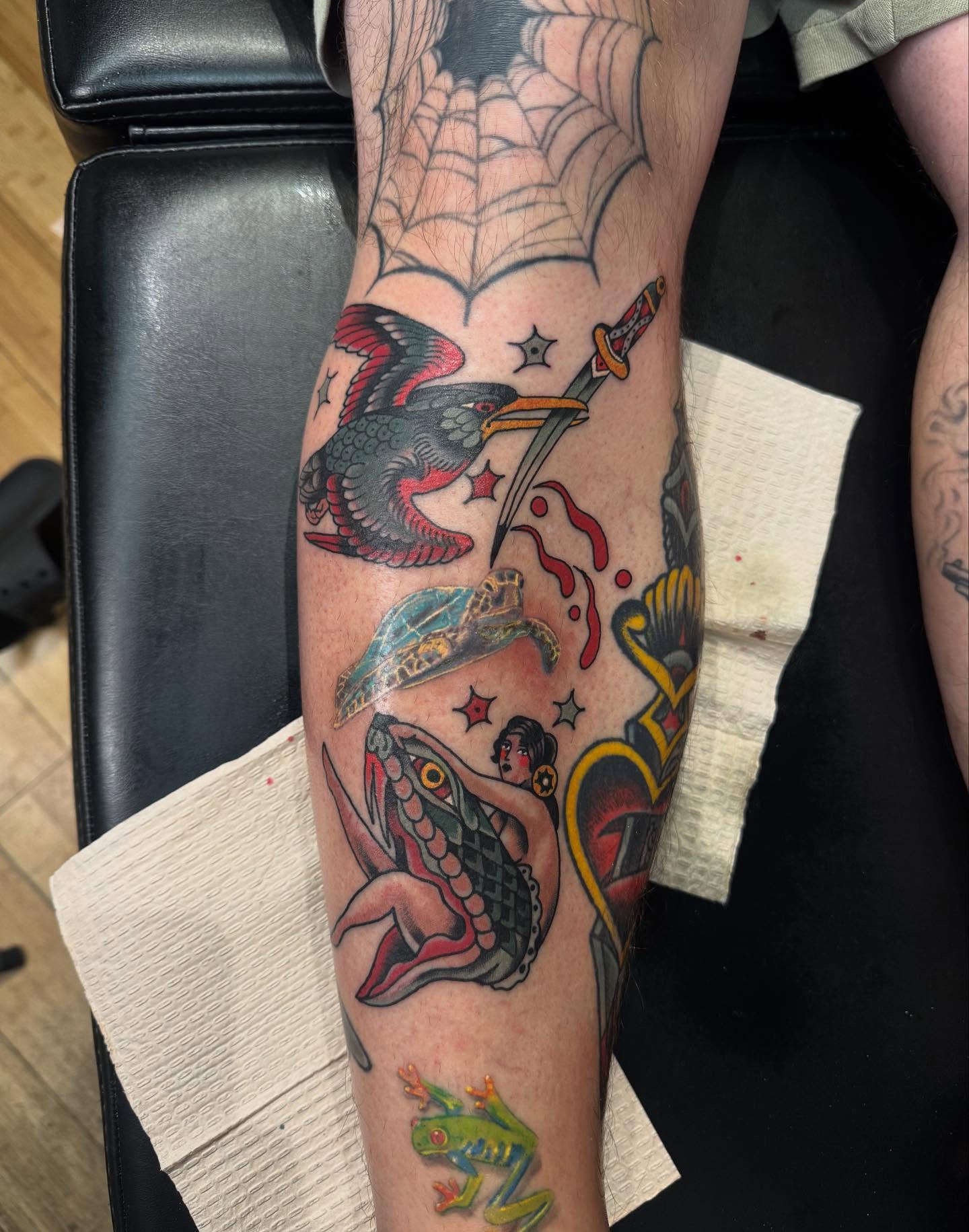 Bird, sword, frog, woman, snake American traditional tattoo on the forearm by Joe Khay, Hackettstown, New Jersey