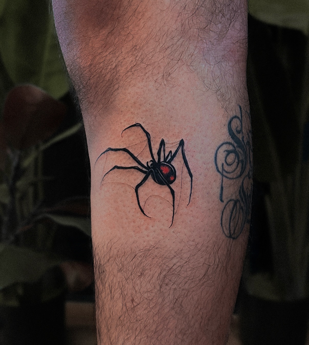 Spider blackwork tattoo on the forearm by Tattoo Artist 👩🏻‍🎨 ATX