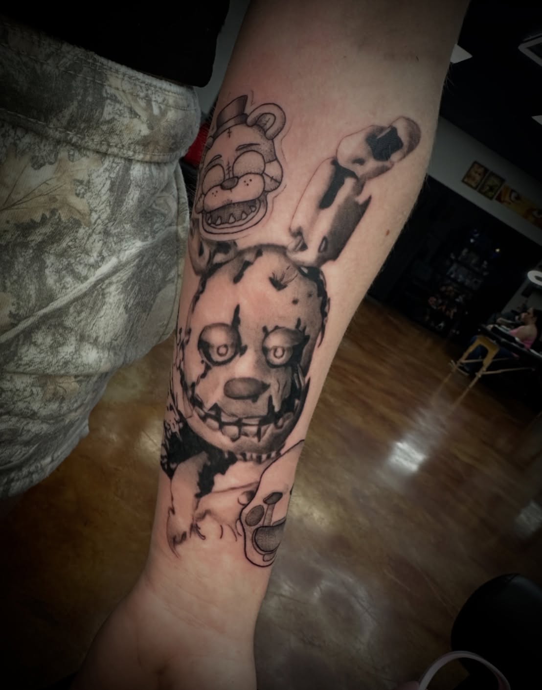 FNAF characters realism tattoo on the forearm by Trent Hebert