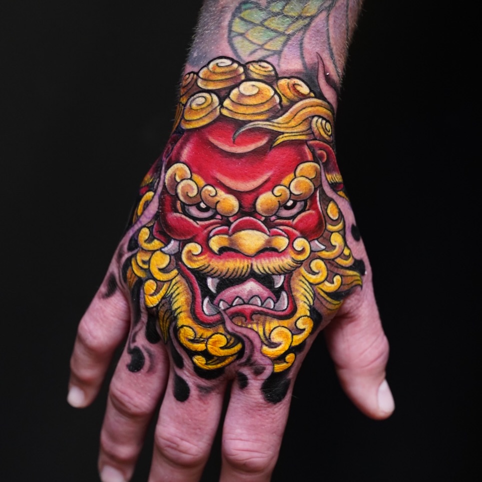 Lion mask japanese irezumi tattoo on the hand by Alonzo Villa Tattoo