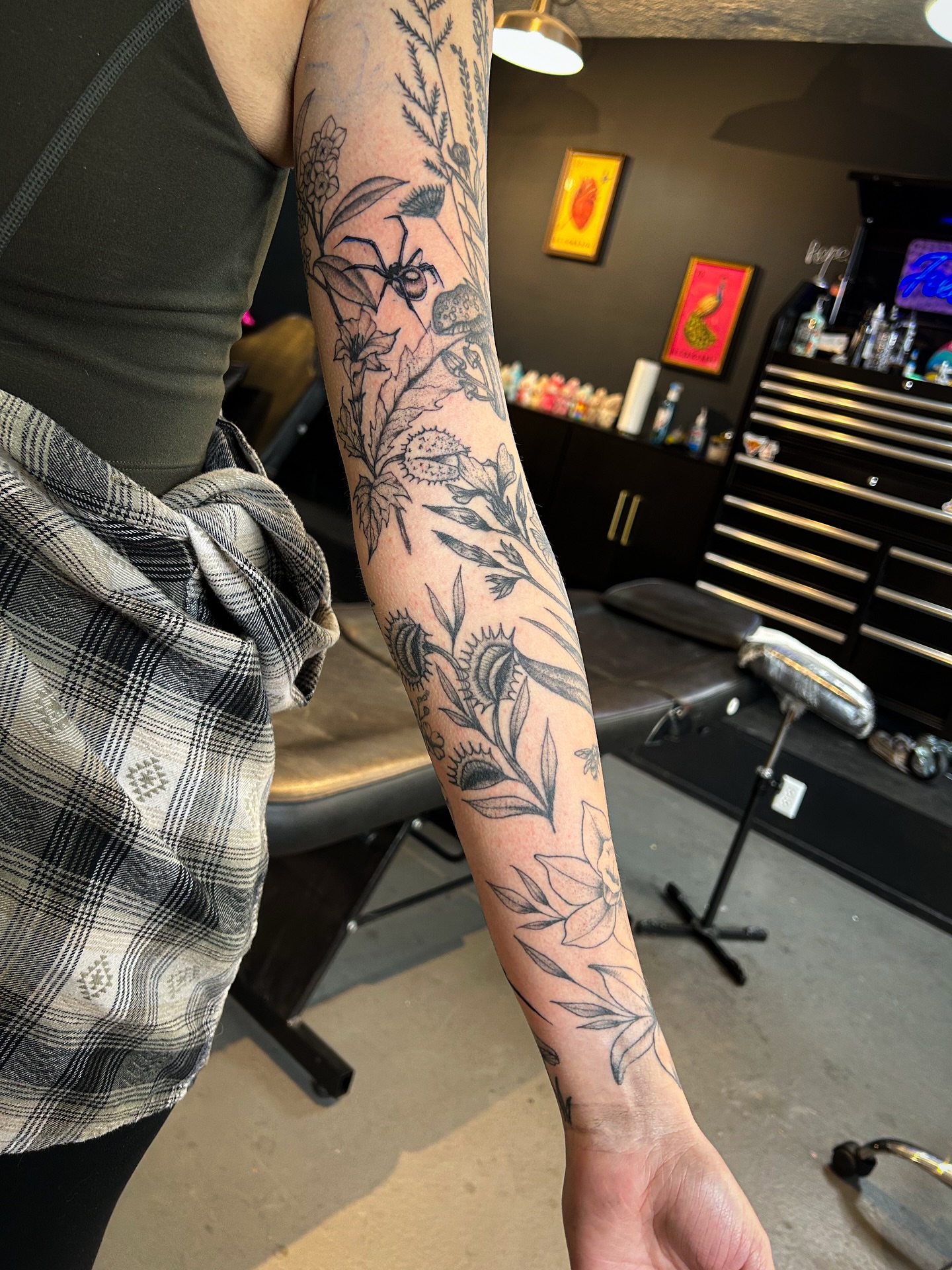 Botanical black and grey tattoo on the forearm by @inkspirationtattoo_co