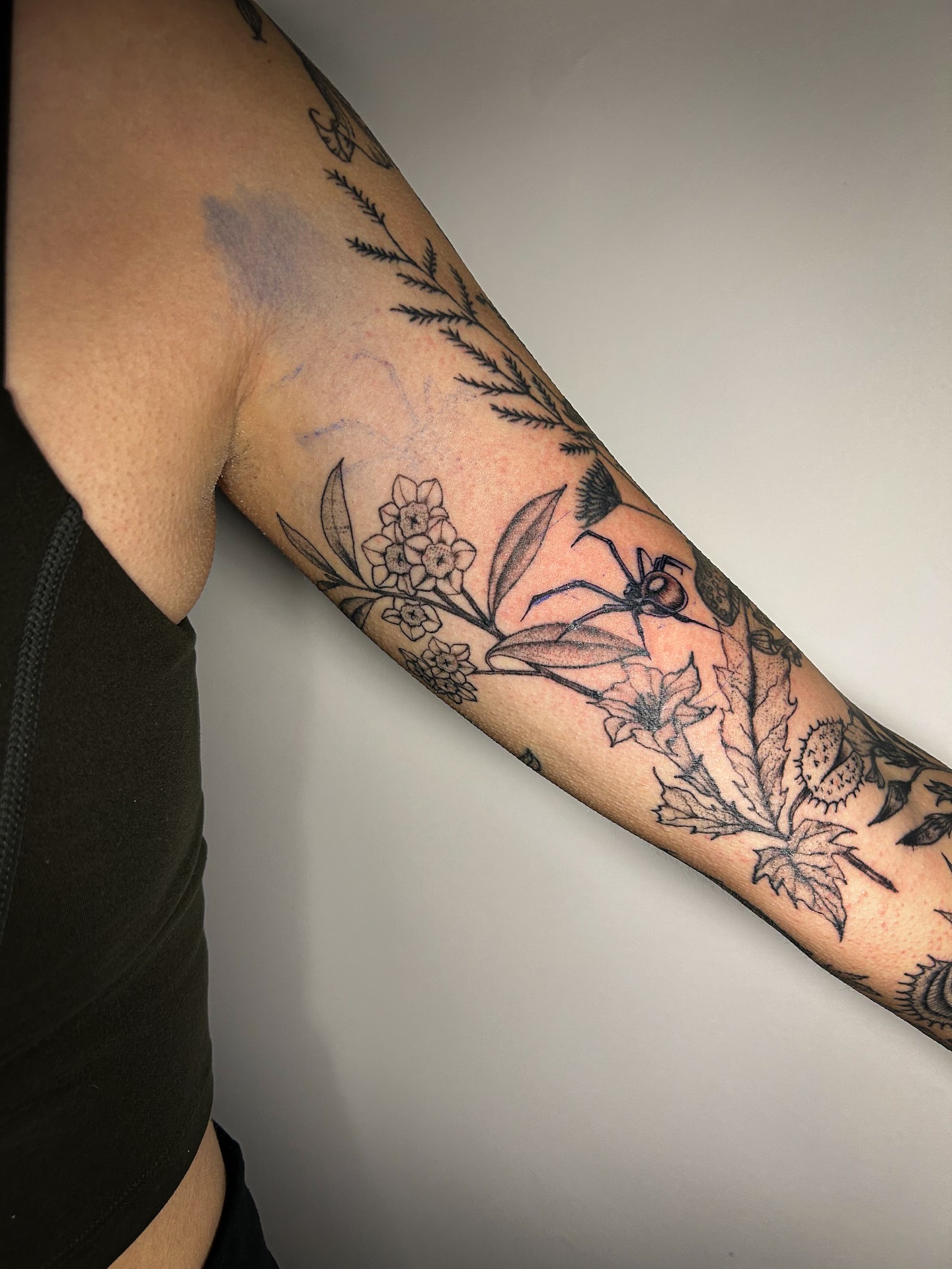 Botanical black and grey tattoo on the forearm by @inkspirationtattoo_co