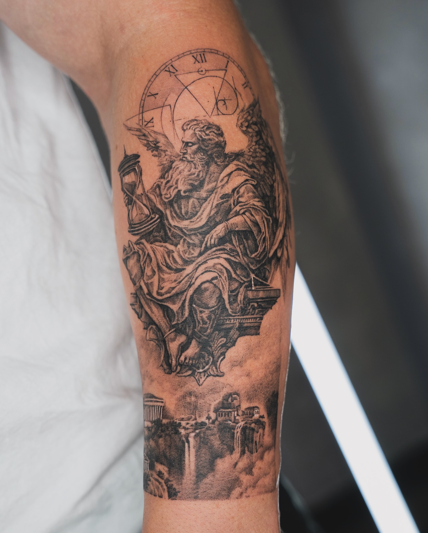 Angel with hourglass realism tattoo on the forearm by Tri
