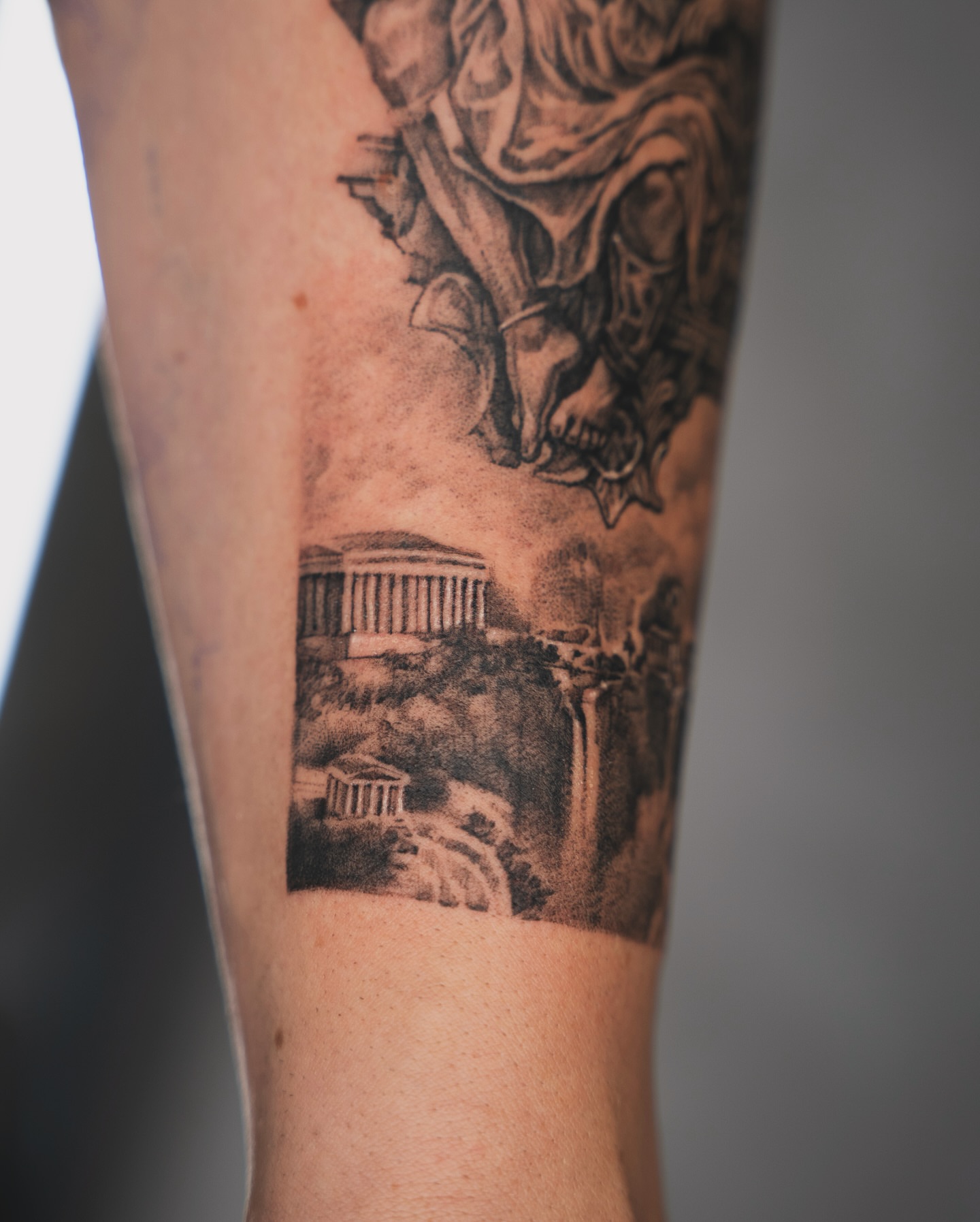 Ancient ruins realism tattoo on the forearm by Tri