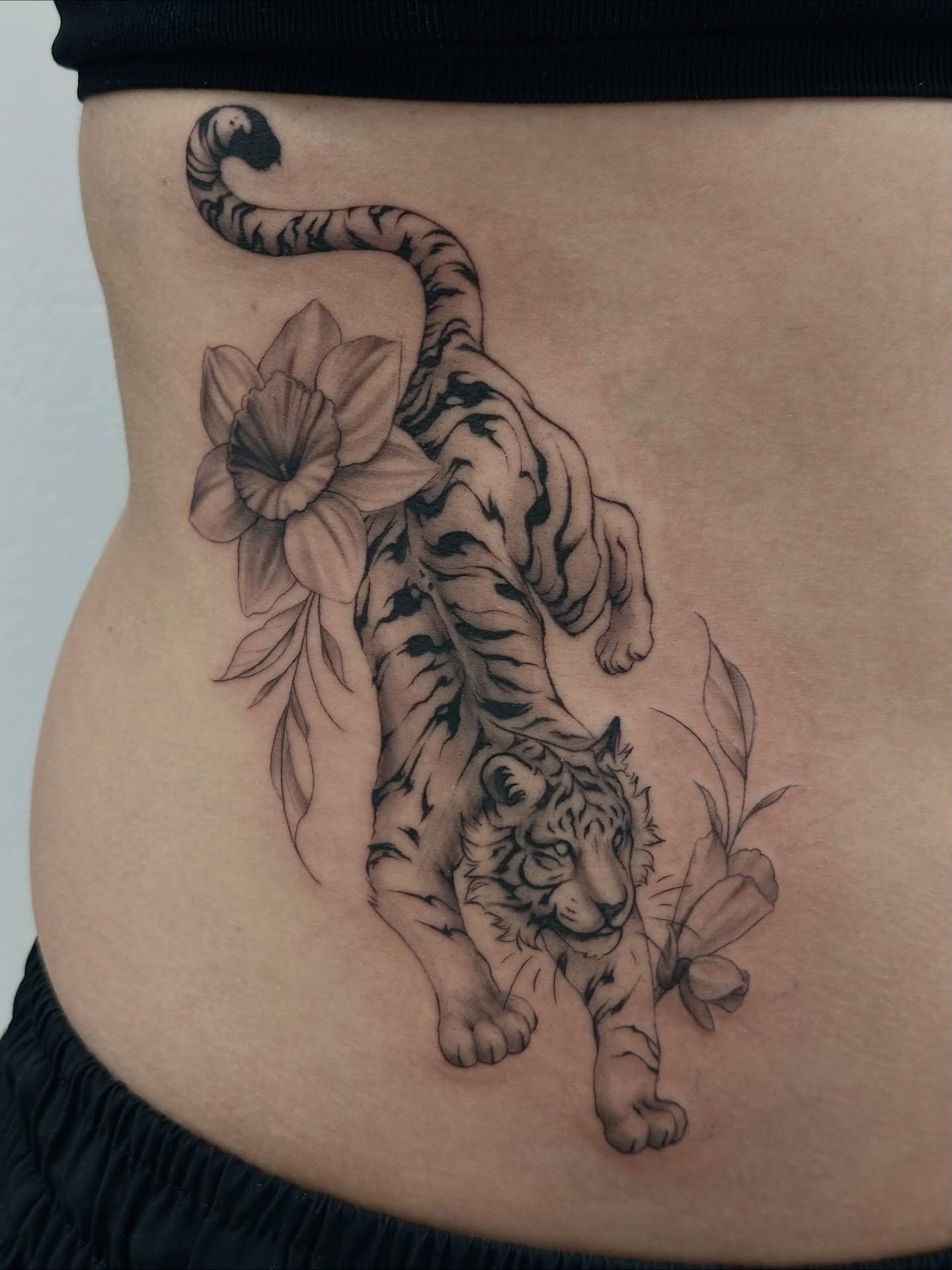 Tiger and flowers realism tattoo on the torso by Winters Ashurst - St. George tattoo artist