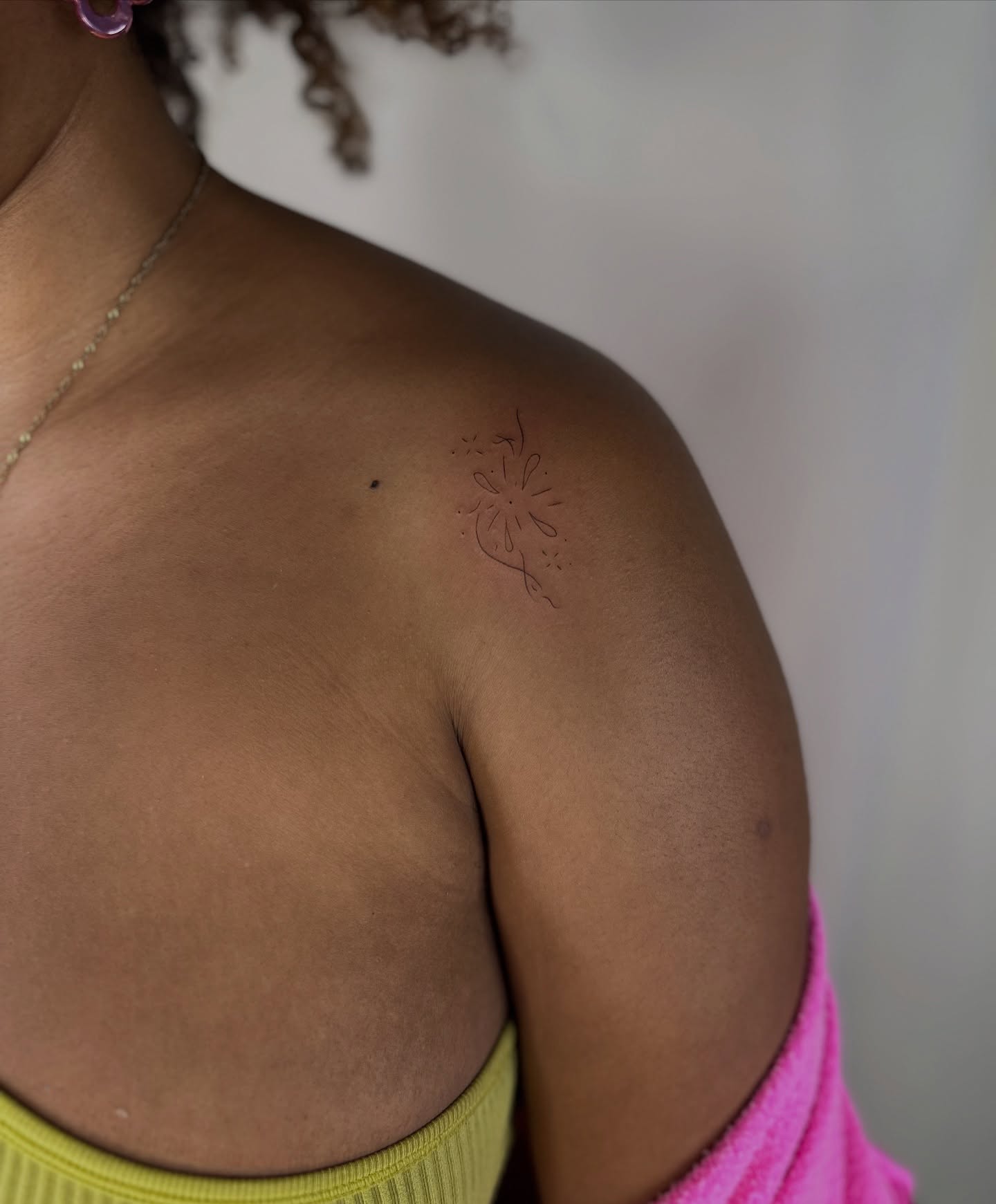 Flower fine line tattoo on the shoulder by Cherry🥀