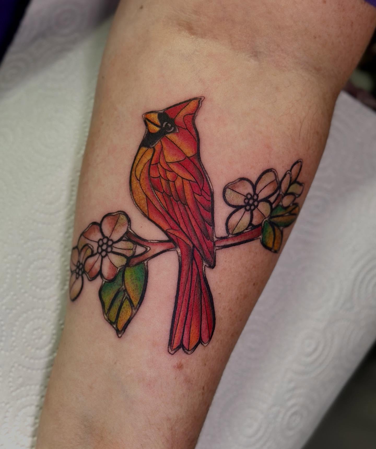 Cardinal bird realism tattoo on the forearm by Erika Nambo