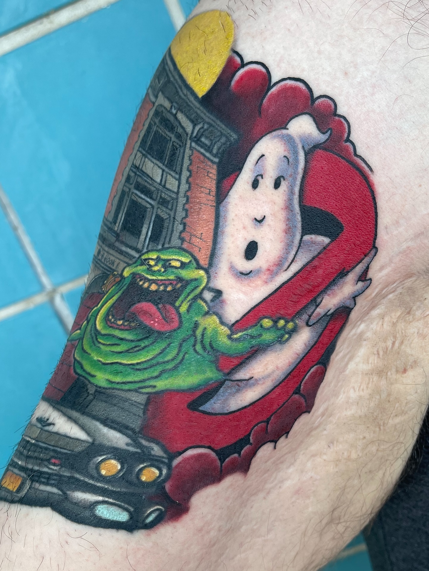 Ghostbusters characters American traditional tattoo on the forearm by Chris Sparks, I just go by Sparks.
