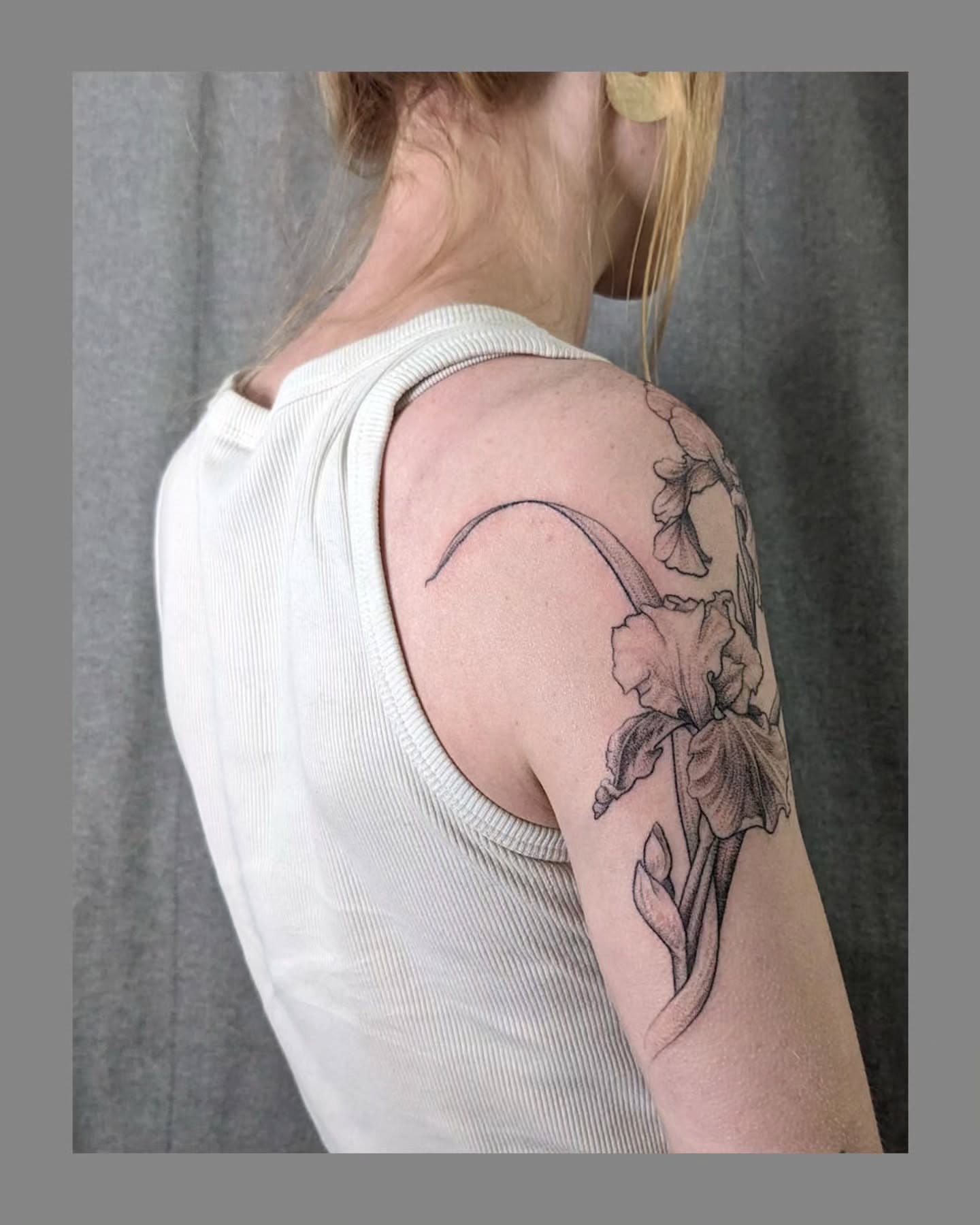 Iris black and grey tattoo on the shoulder by Marria