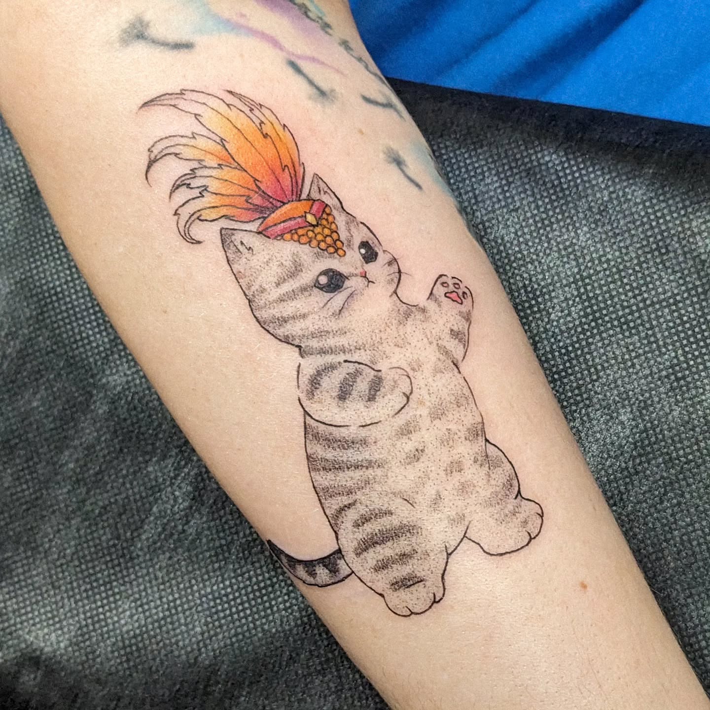 Cat with fish dotwork tattoo on the forearm by robin ✨ portland tattoo artist