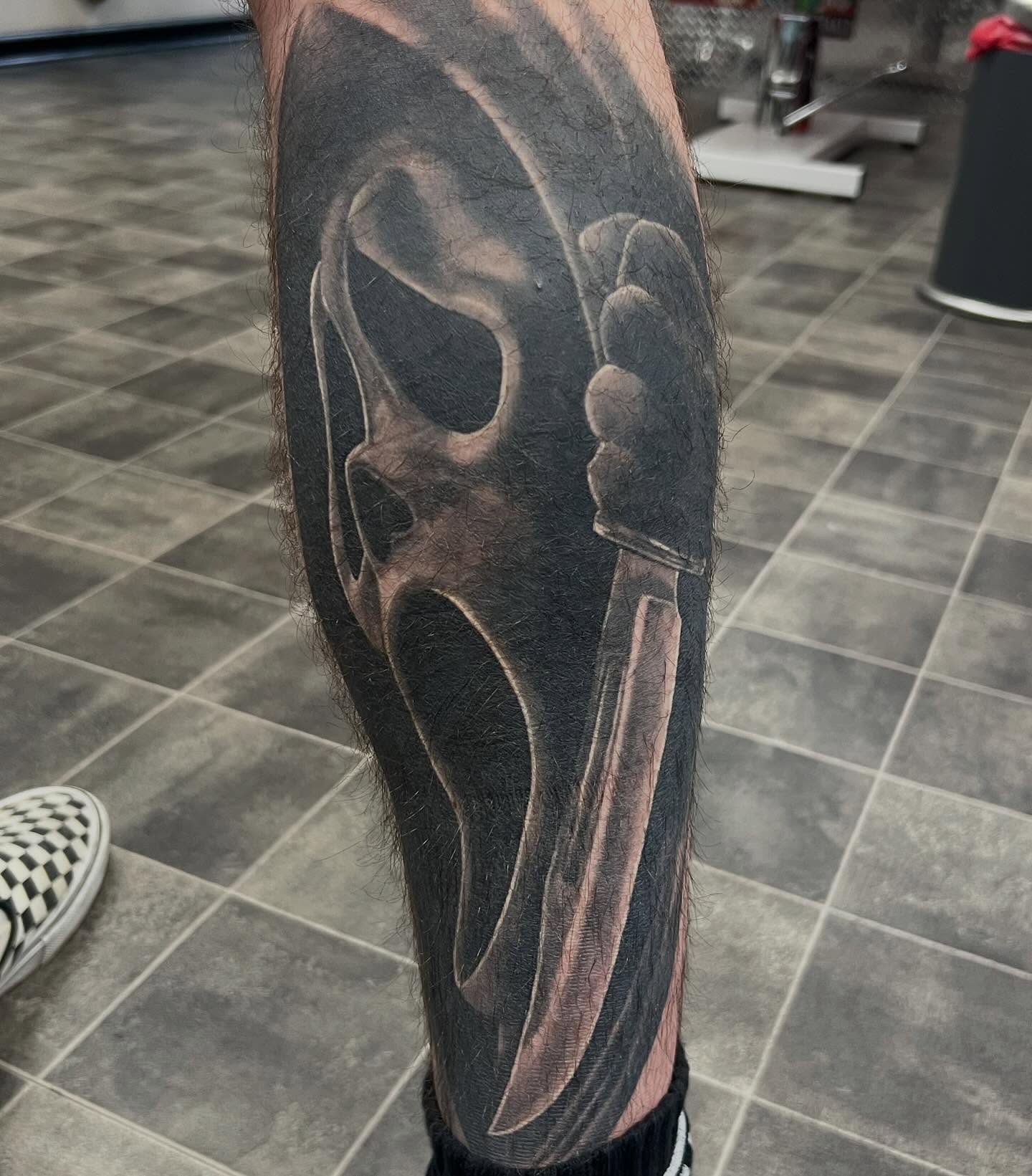 Mask with knife realism tattoo on the forearm by Don Peddicord