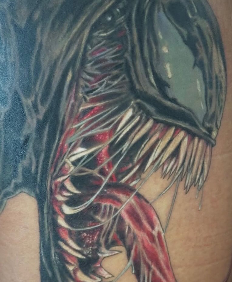 Alien creature dark realism tattoo on the upper arm by George Zabala, Rockdale, Illinois