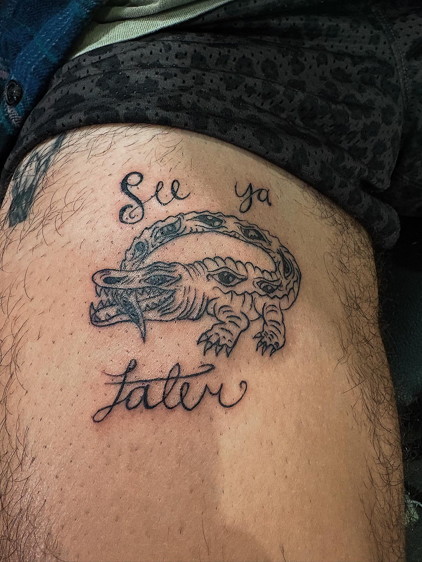 Crocodile black and grey tattoo on the thigh by Luke