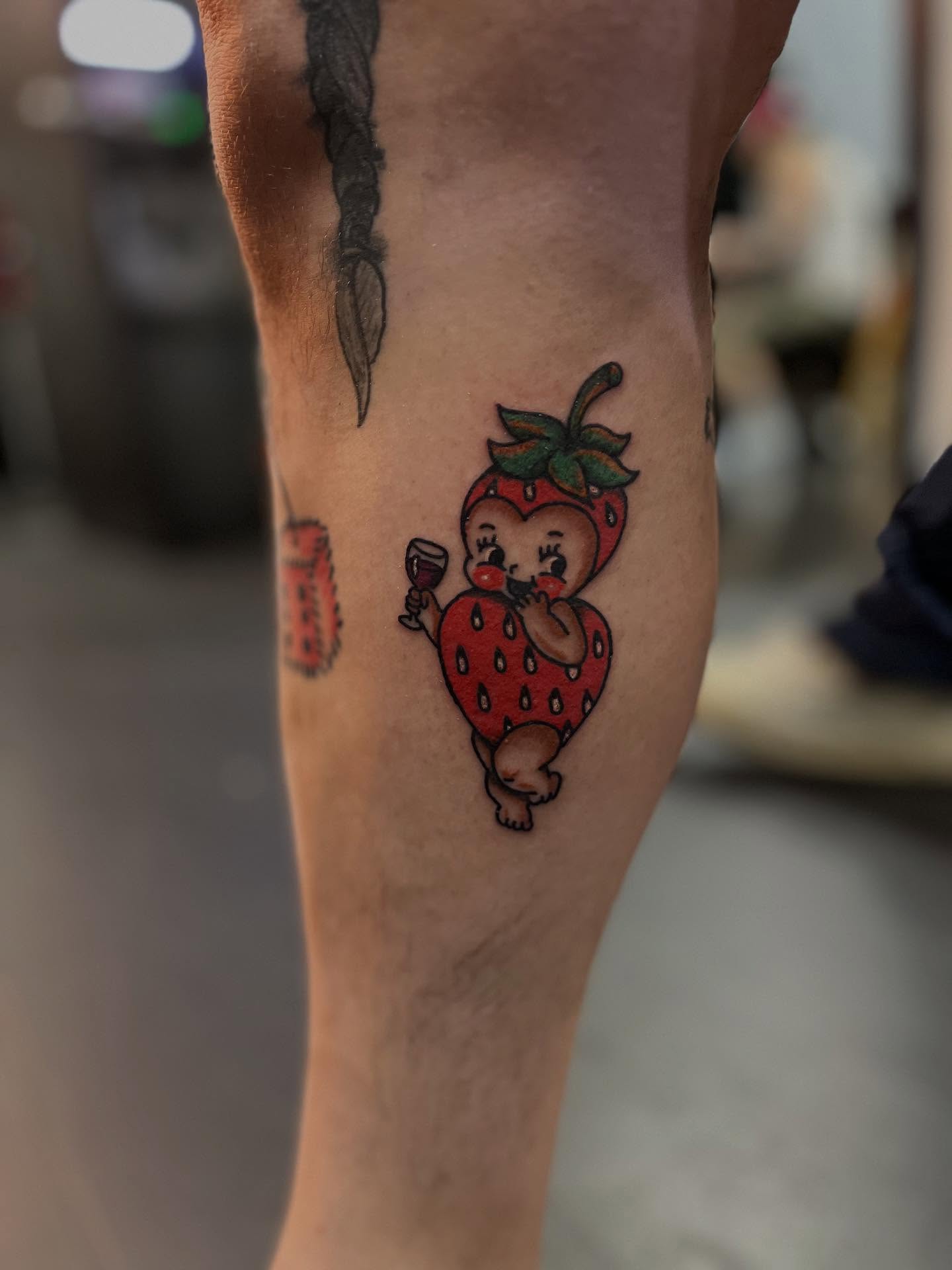 Strawberry character American traditional tattoo on the forearm by CRAIG B⛓️ Cincinnati Tattoo Artist