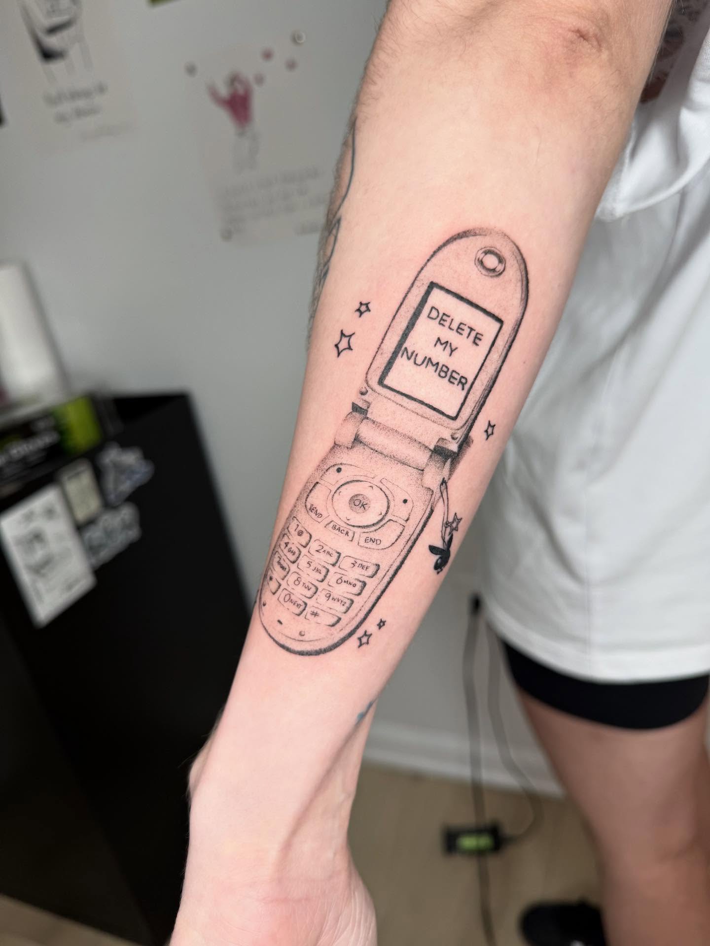 Flip phone black and grey tattoo on the forearm by 🗡Addie Kat🗡